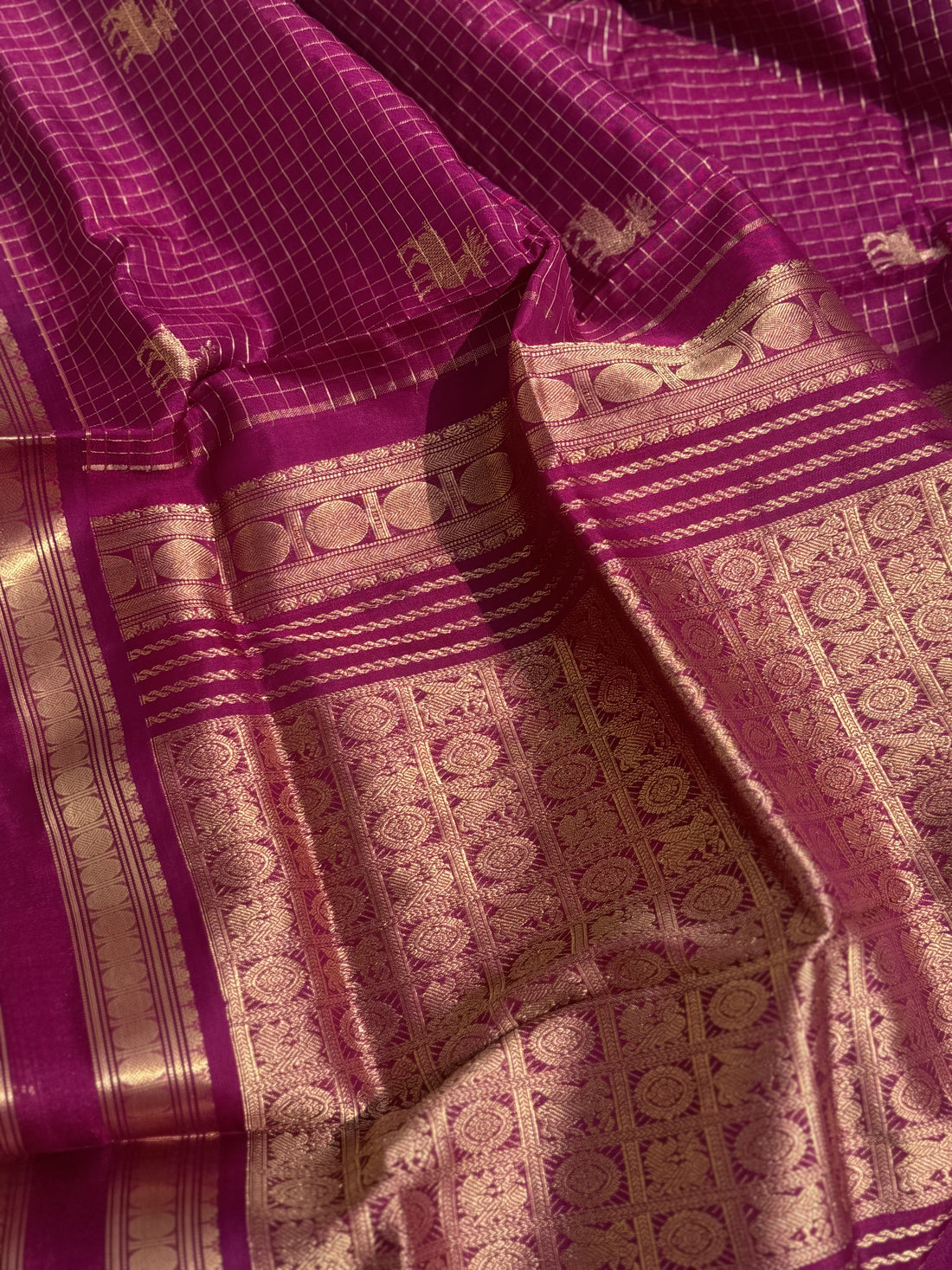 A gorgeous Plum pink zari checks weave with deer motifs handwoven kanchi silk cotton saree