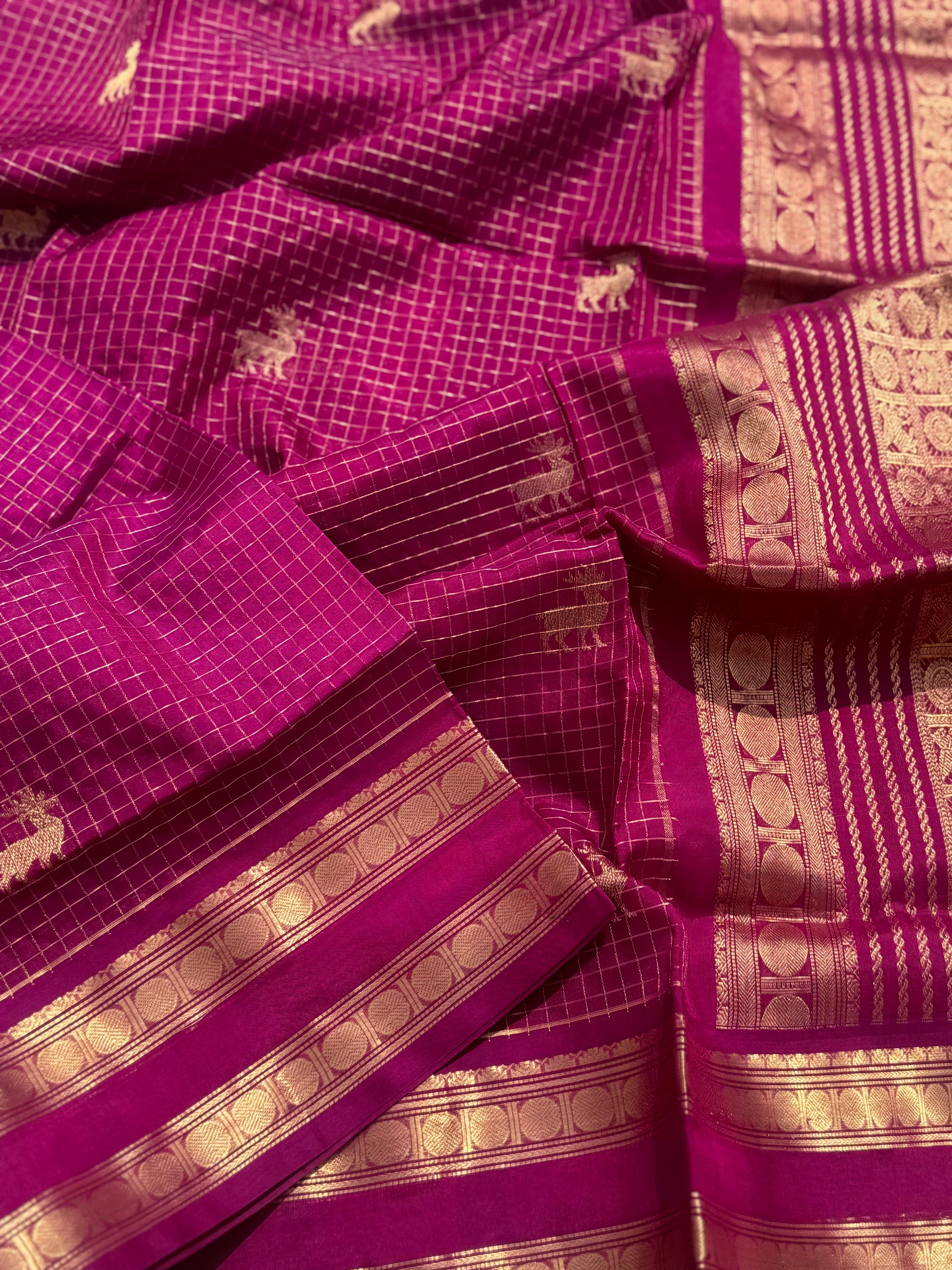 A gorgeous deep pink shade handwoven zari checks with deer motifs Kanchi silk cotton saree