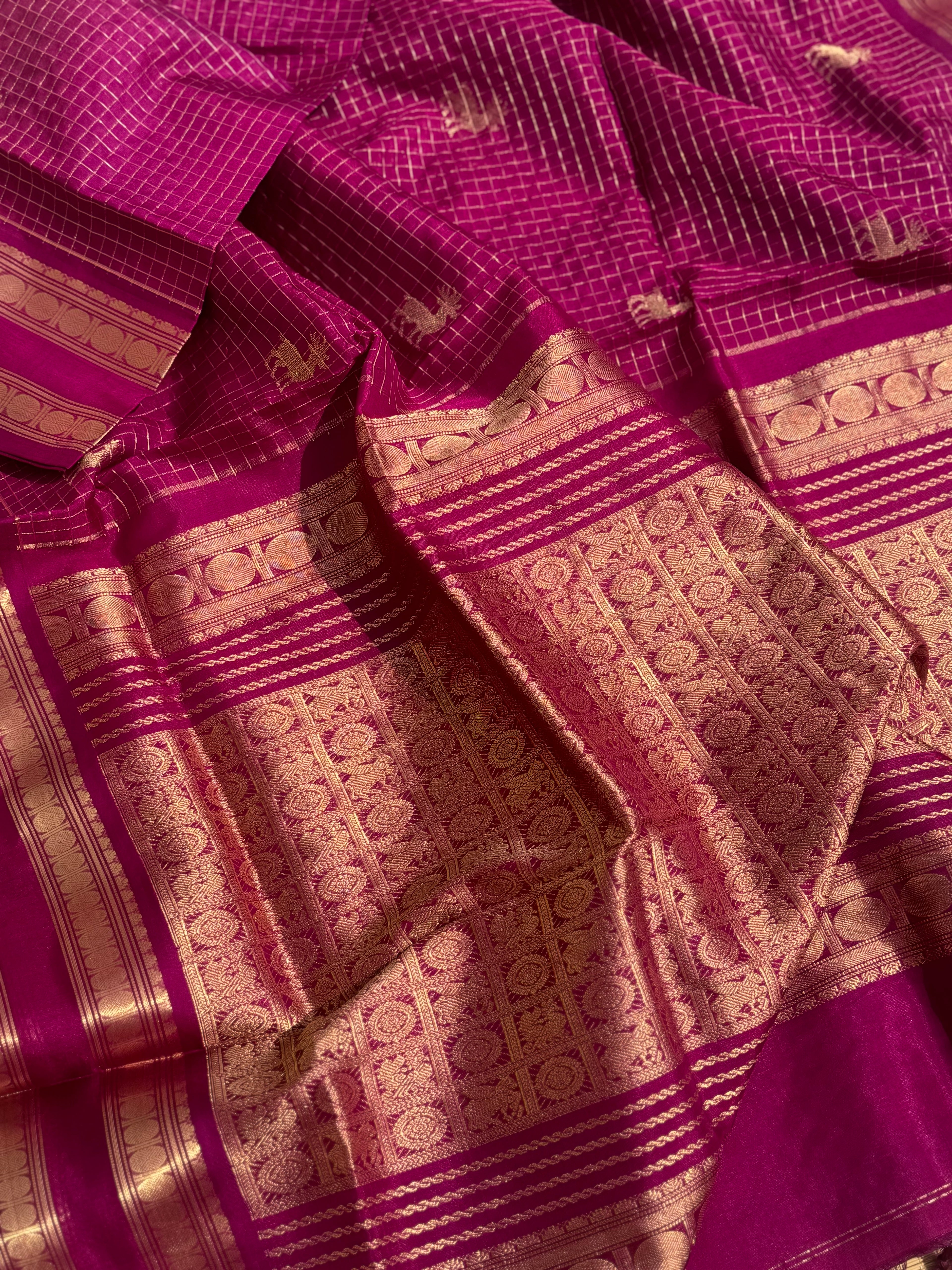 A gorgeous deep pink shade handwoven zari checks with deer motifs Kanchi silk cotton saree