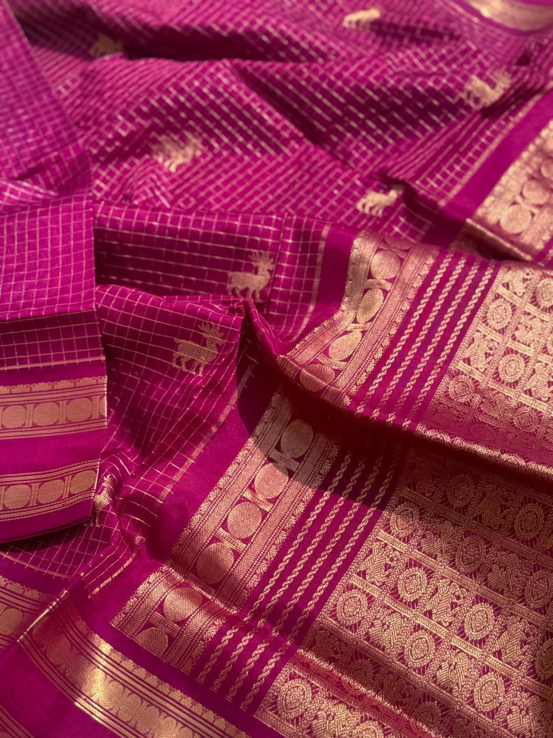 A gorgeous deep pink shade handwoven zari checks with deer motifs Kanchi silk cotton saree