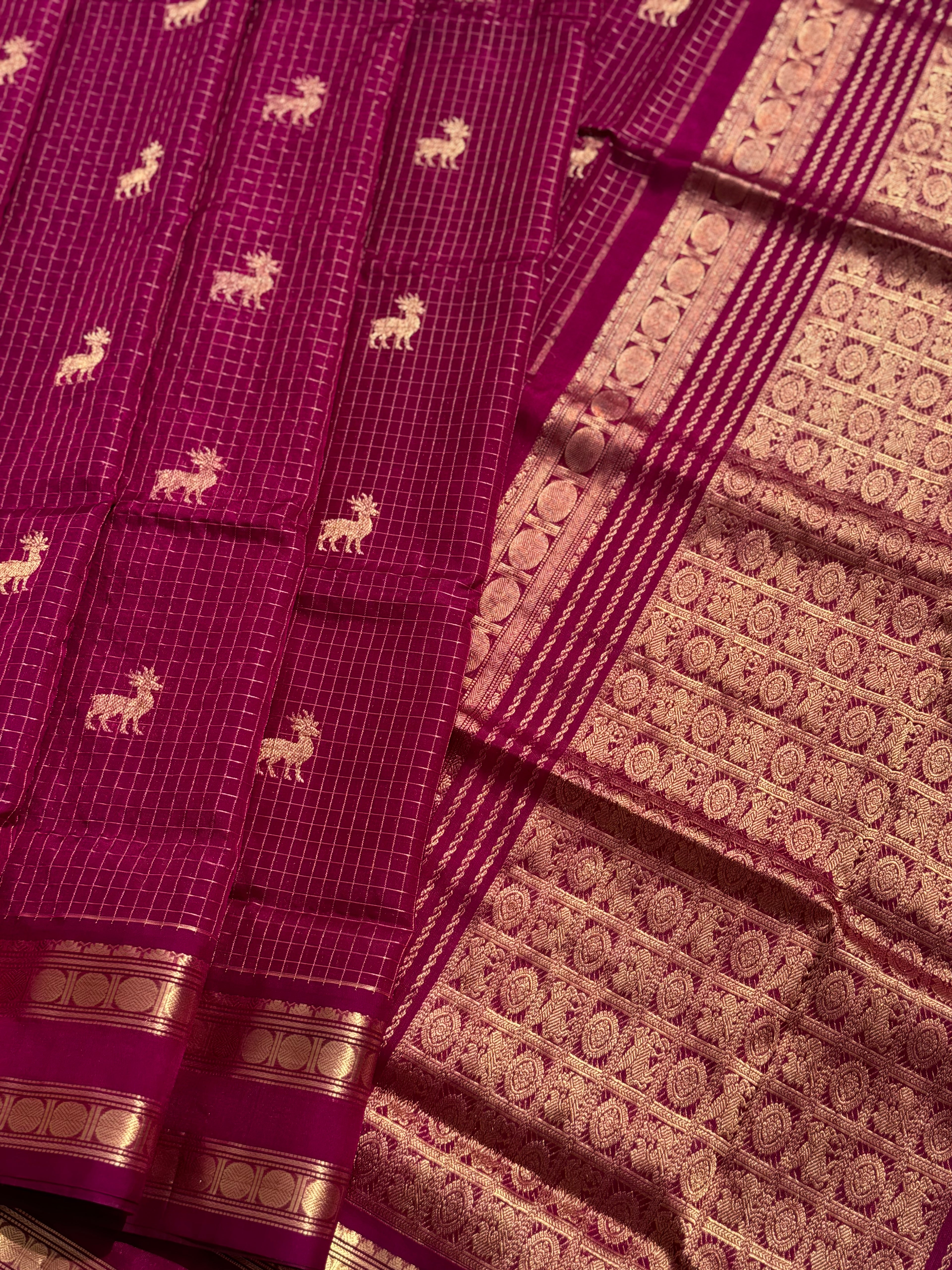 A gorgeous deep pink shade handwoven zari checks with deer motifs Kanchi silk cotton saree