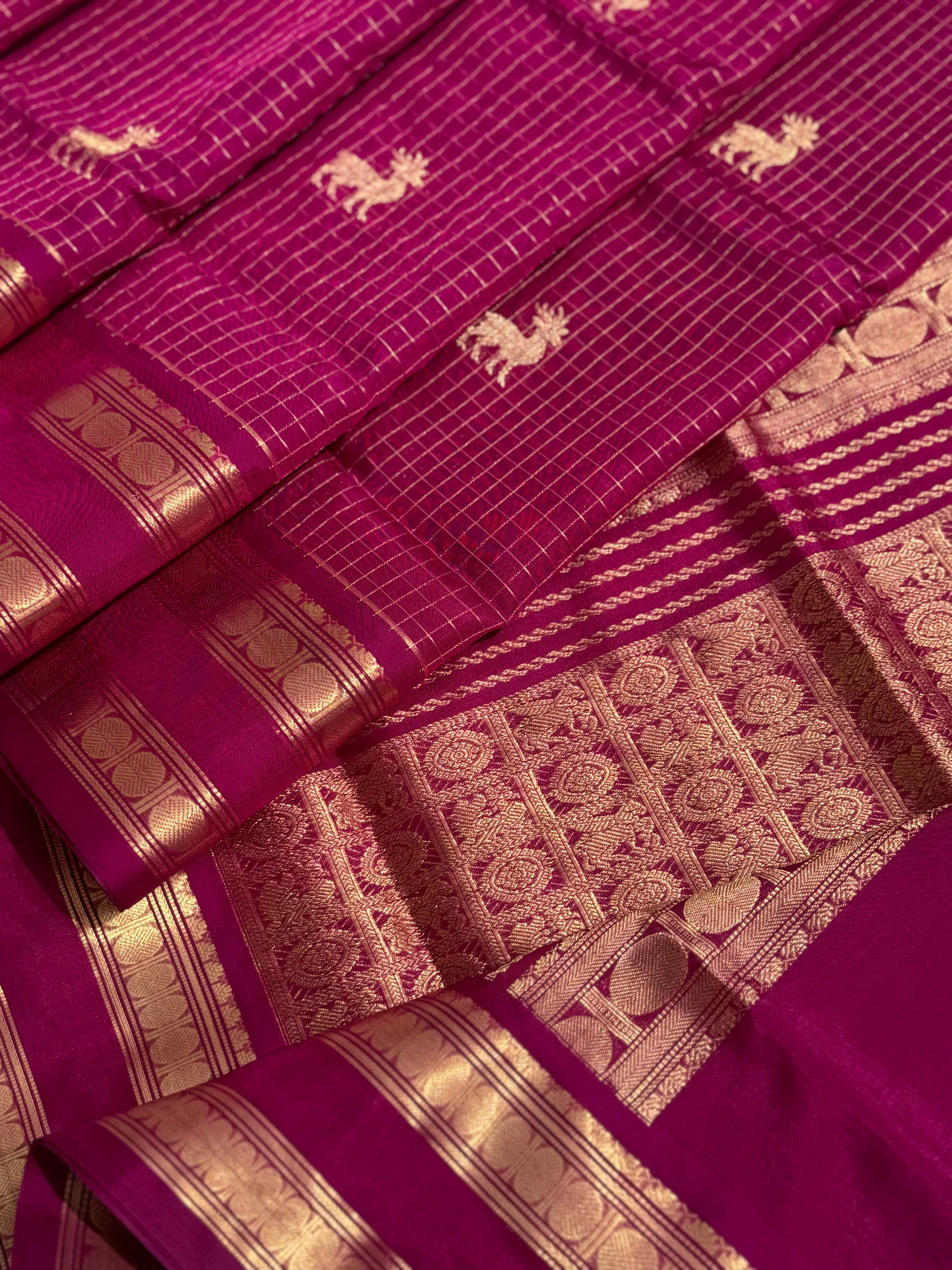 A gorgeous deep pink shade handwoven zari checks with deer motifs Kanchi silk cotton saree