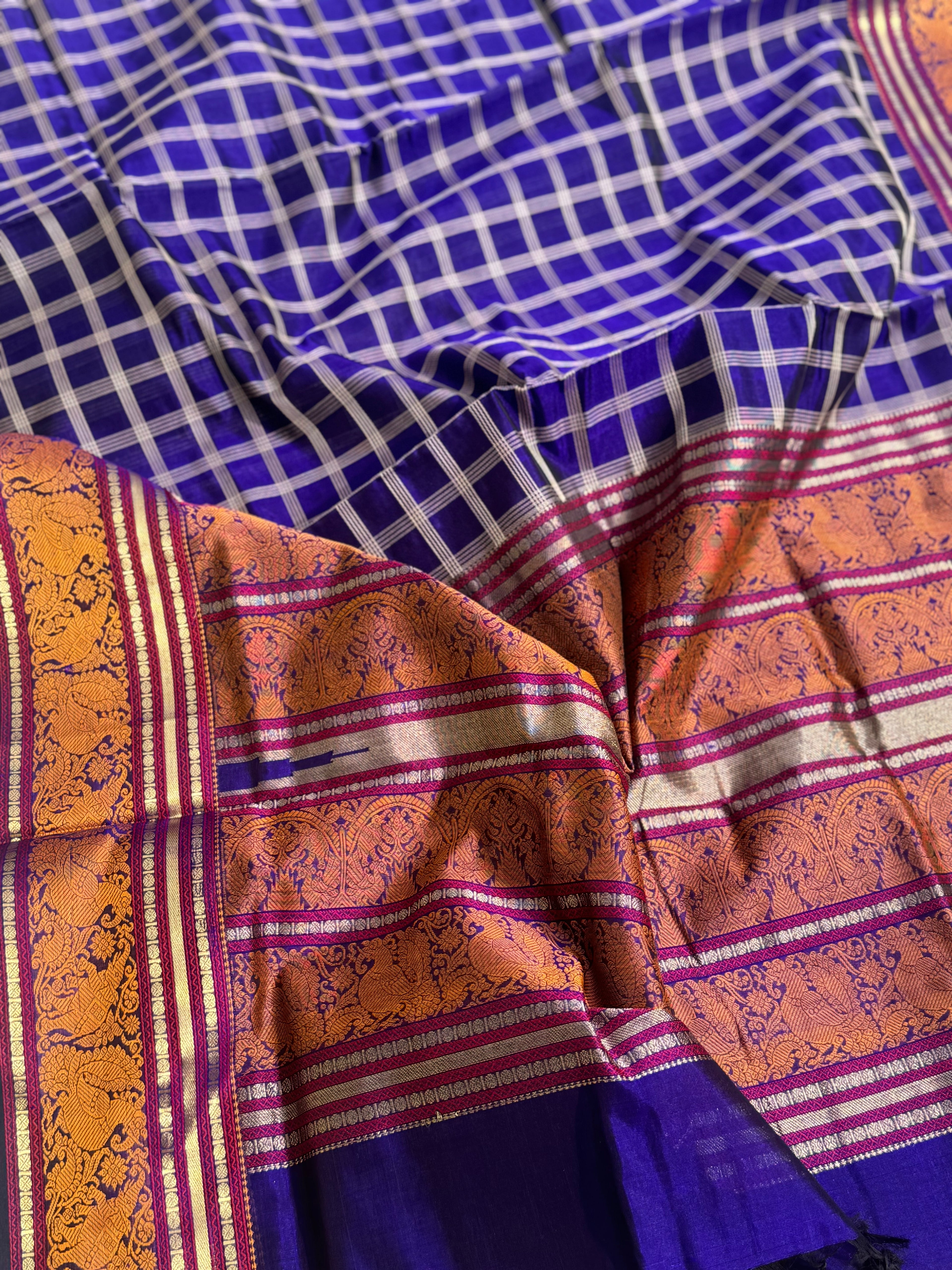 A gorgeous royal blue shade handwoven zari checks with Kanchi silk cotton saree