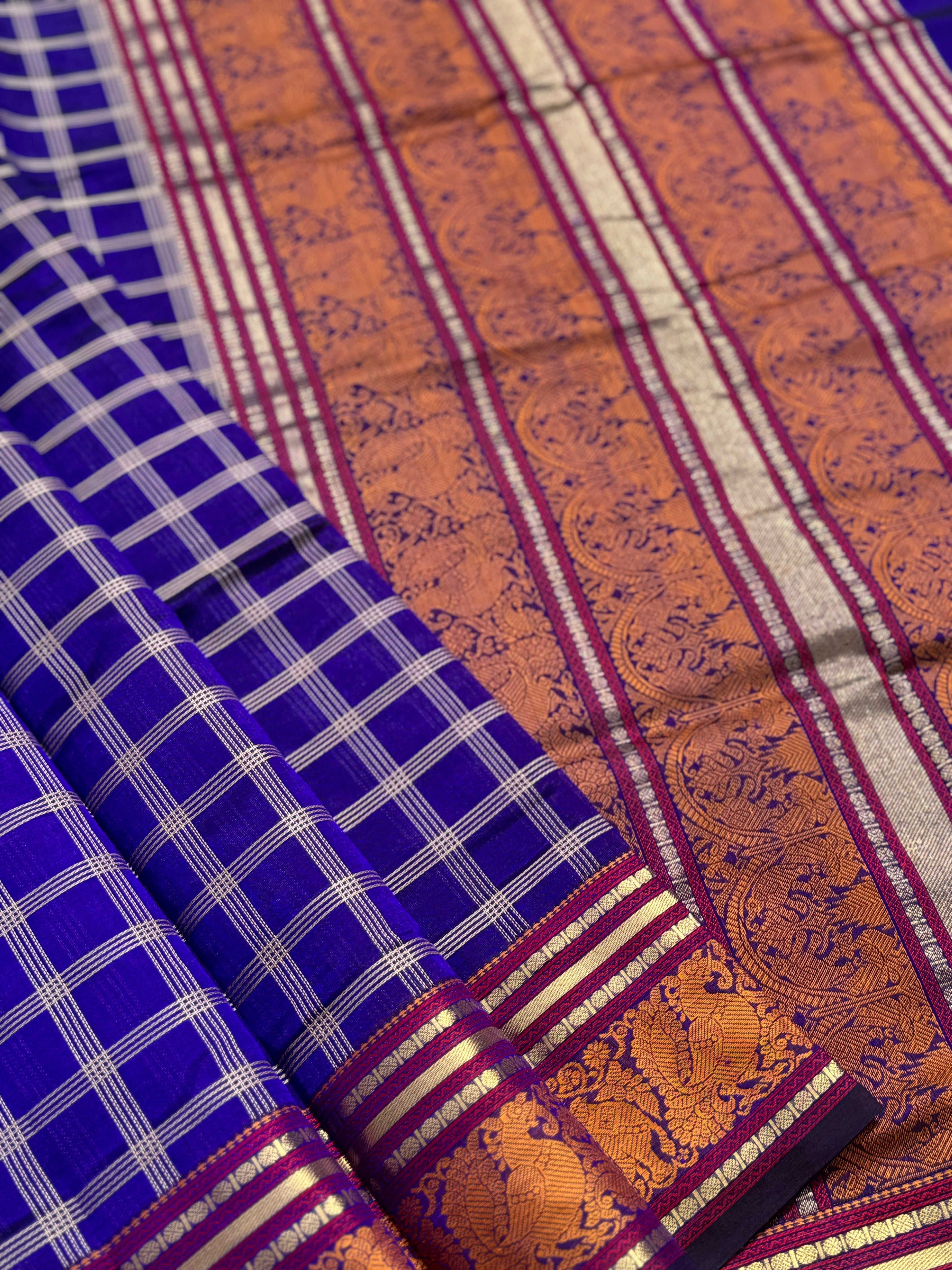 A gorgeous royal blue shade handwoven zari checks with Kanchi silk cotton saree
