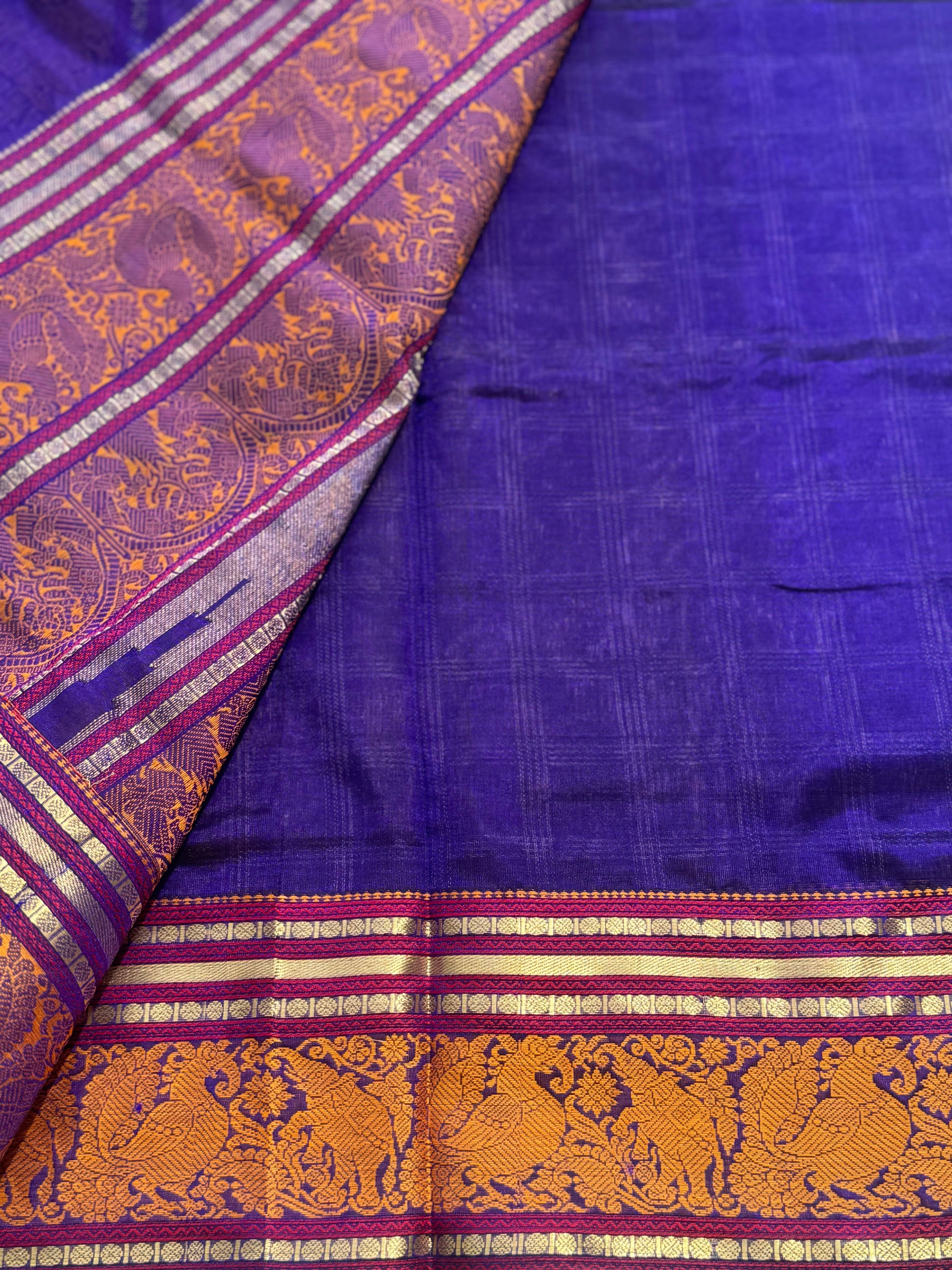 A gorgeous royal blue shade handwoven zari checks with Kanchi silk cotton saree