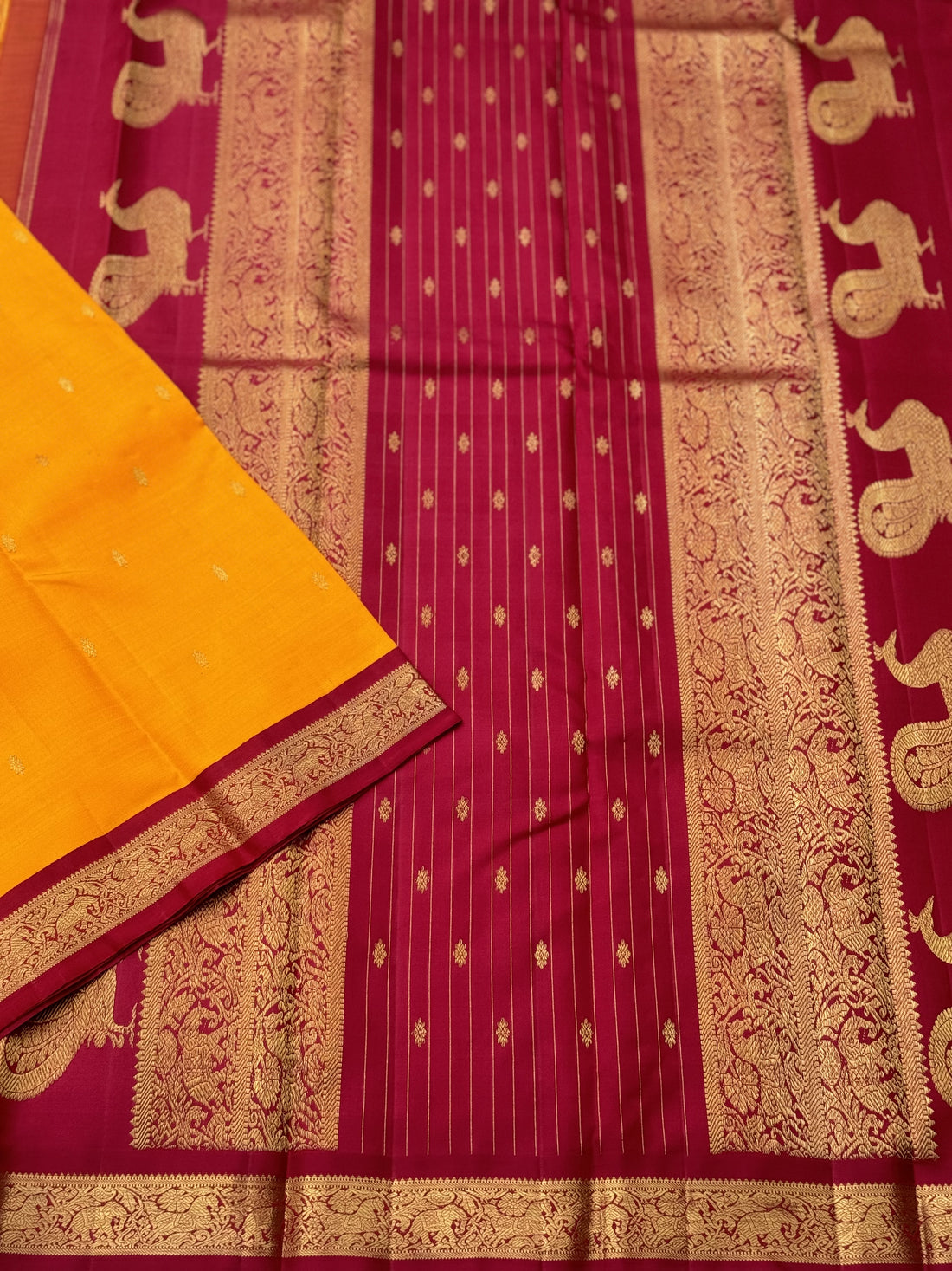 A stunner Masterpiece kanchivaram korvai silk saree in Mango yellow with arakku