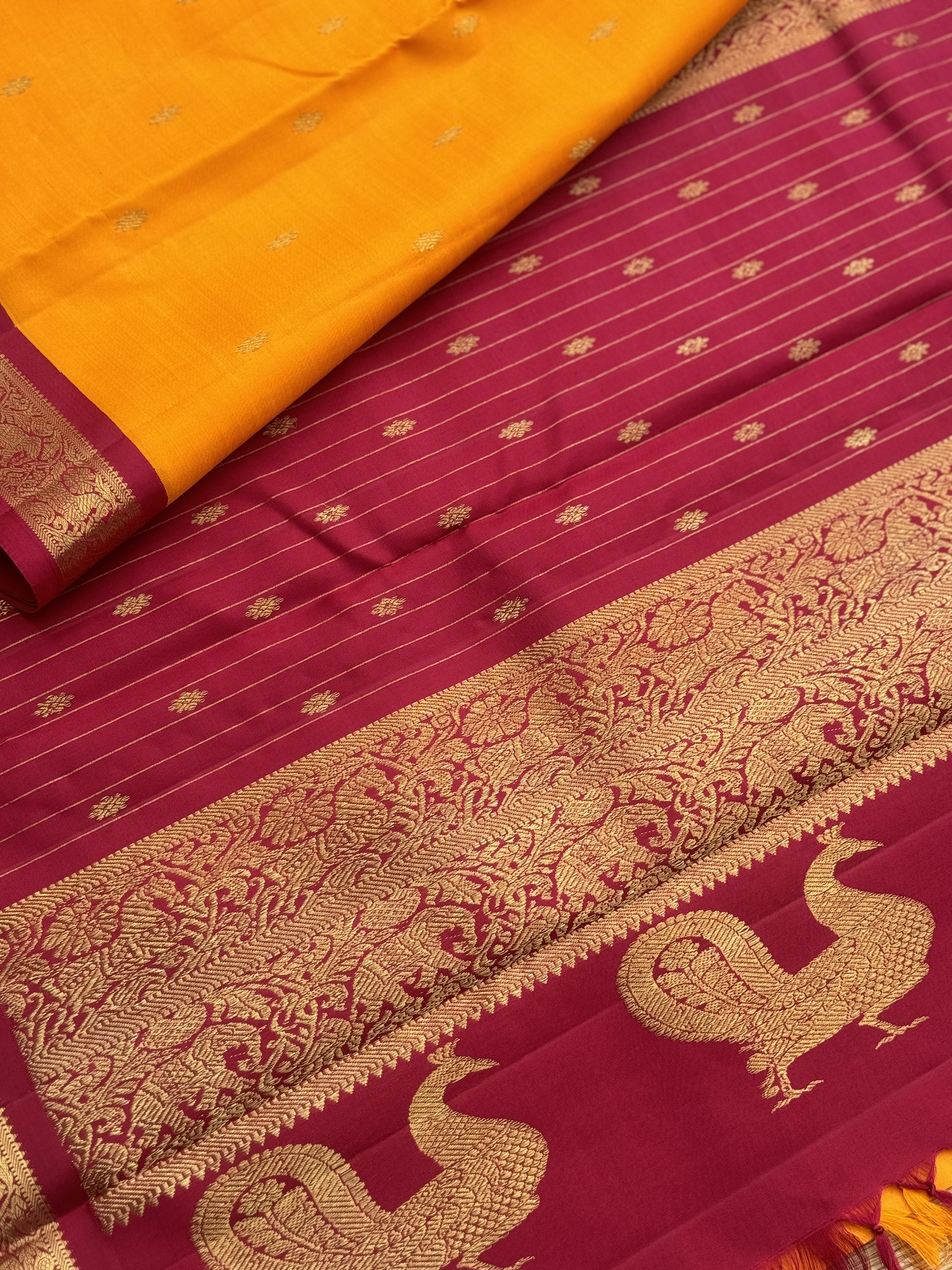 A stunner Masterpiece kanchivaram korvai silk saree in Mango yellow with arakku