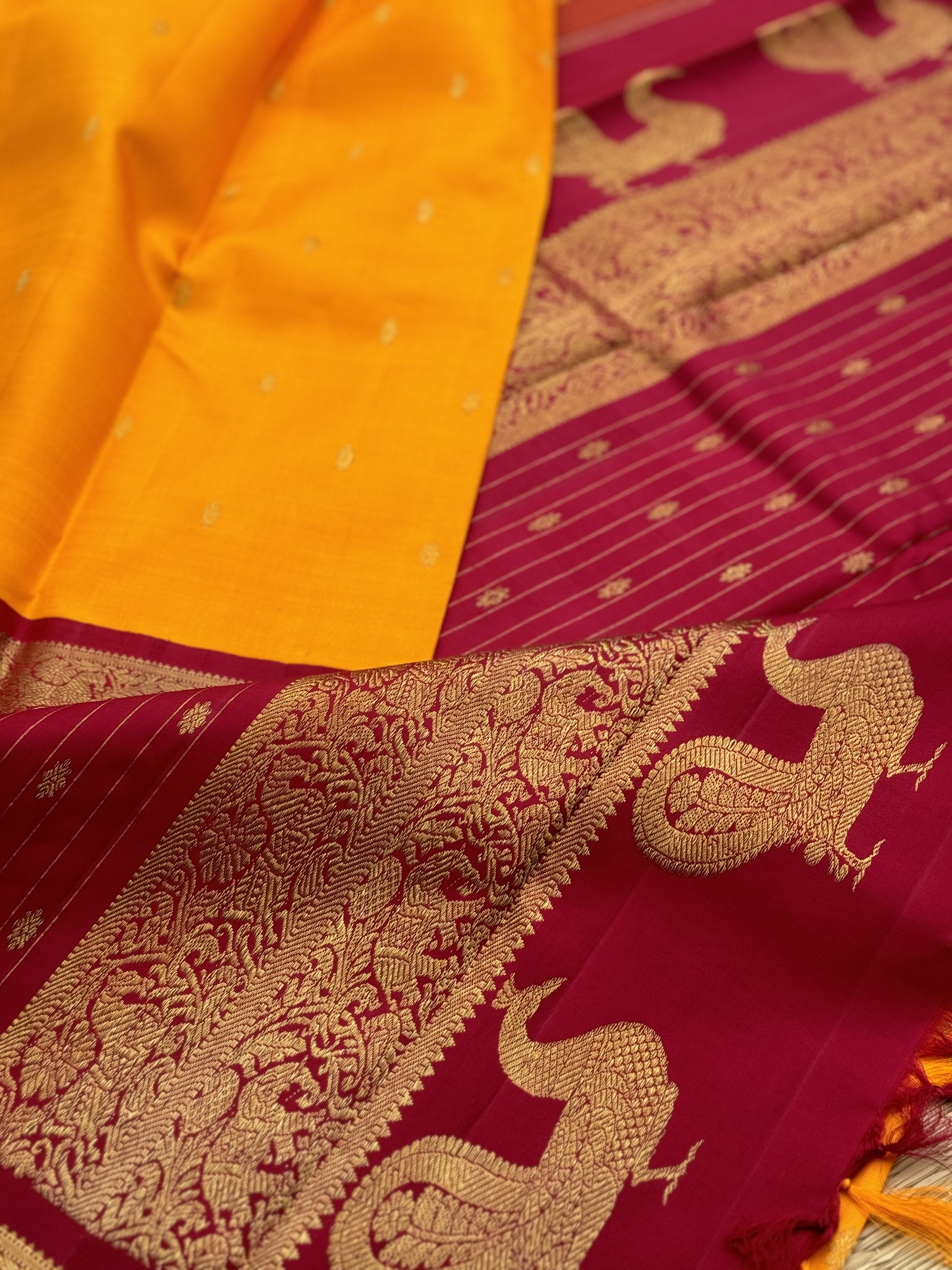 A stunner Masterpiece kanchivaram korvai silk saree in Mango yellow with arakku