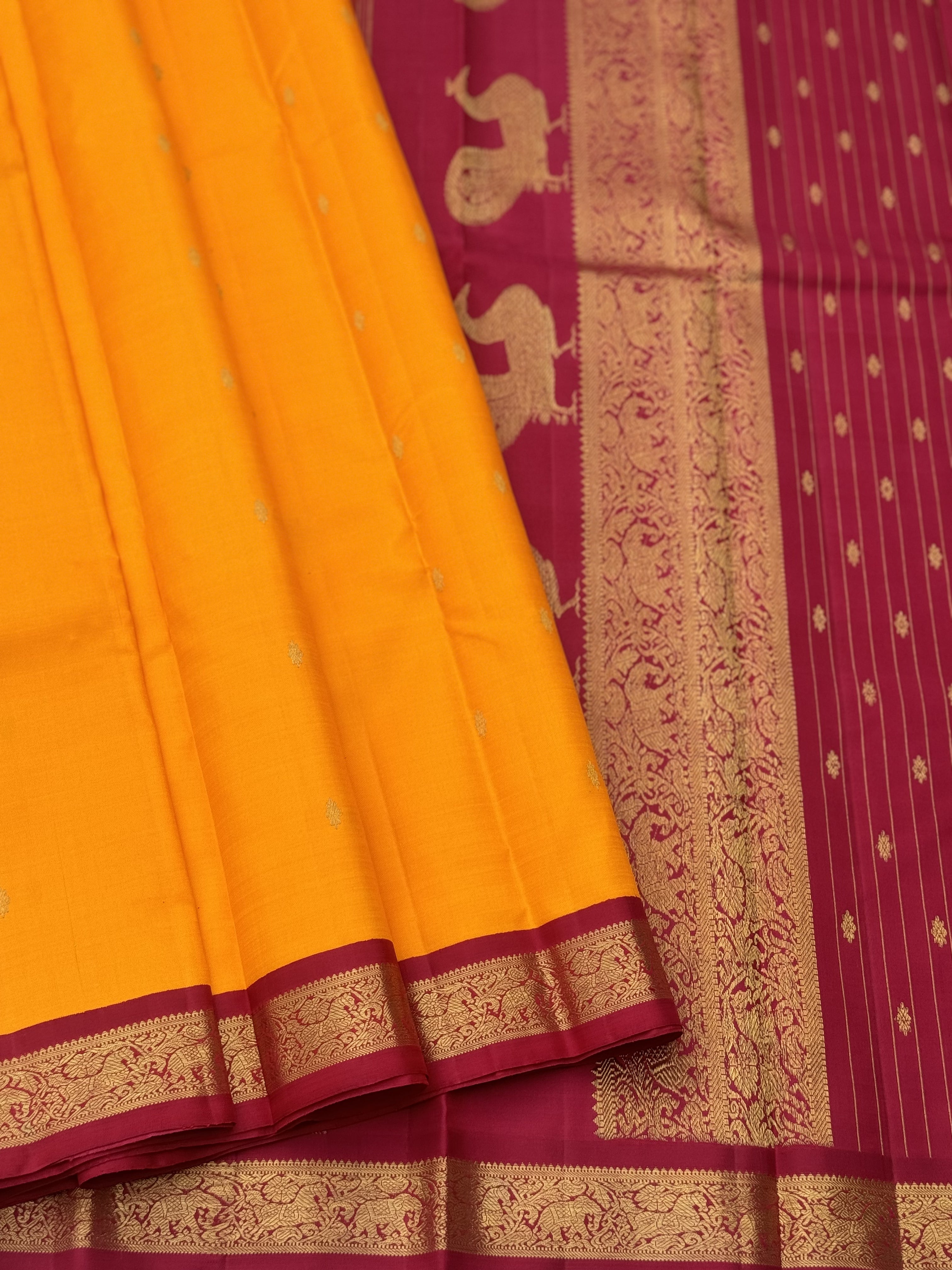 A stunner Masterpiece kanchivaram korvai silk saree in Mango yellow with arakku