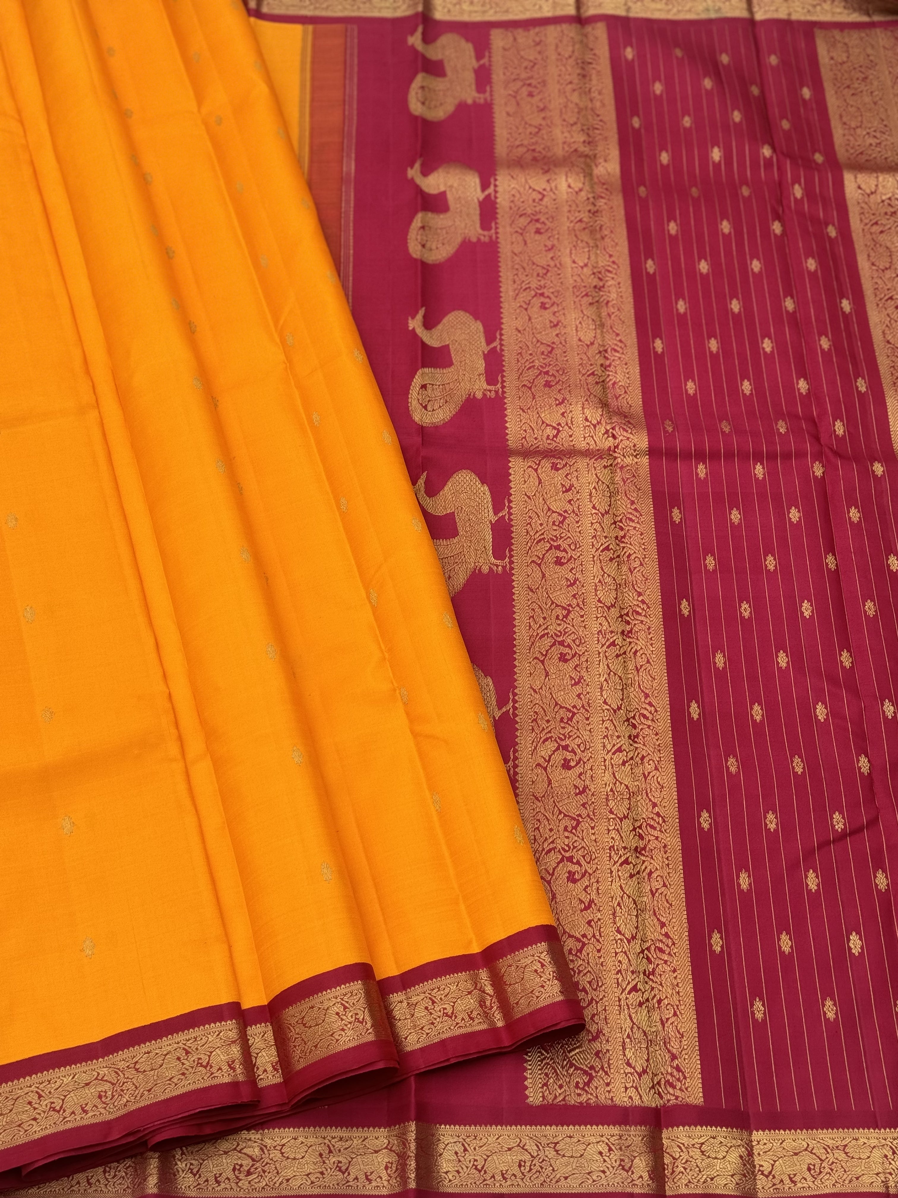 A stunner Masterpiece kanchivaram korvai silk saree in Mango yellow with arakku