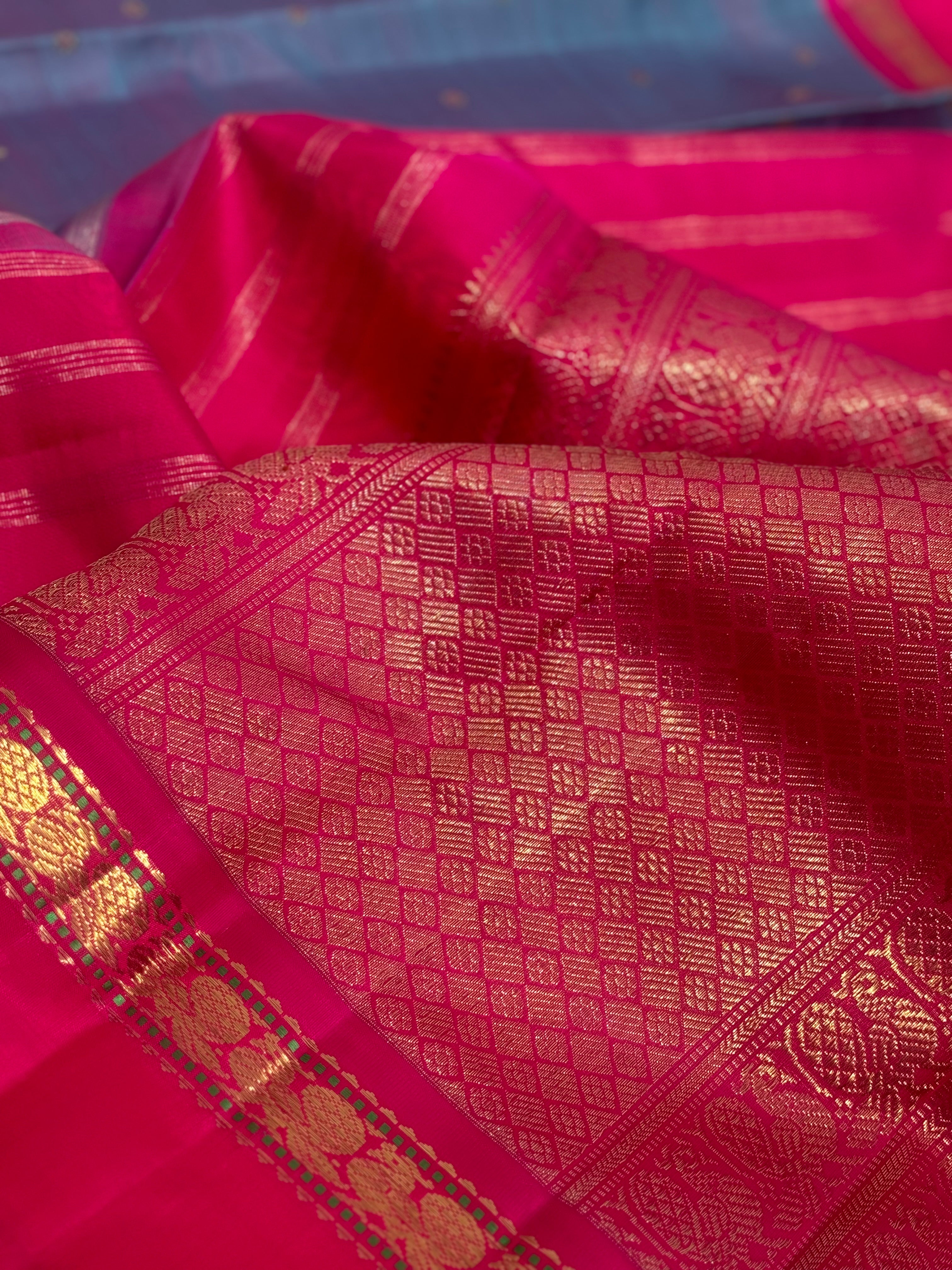 A Masterpiece kanchivaram korvai silk saree in peacock blue with pink