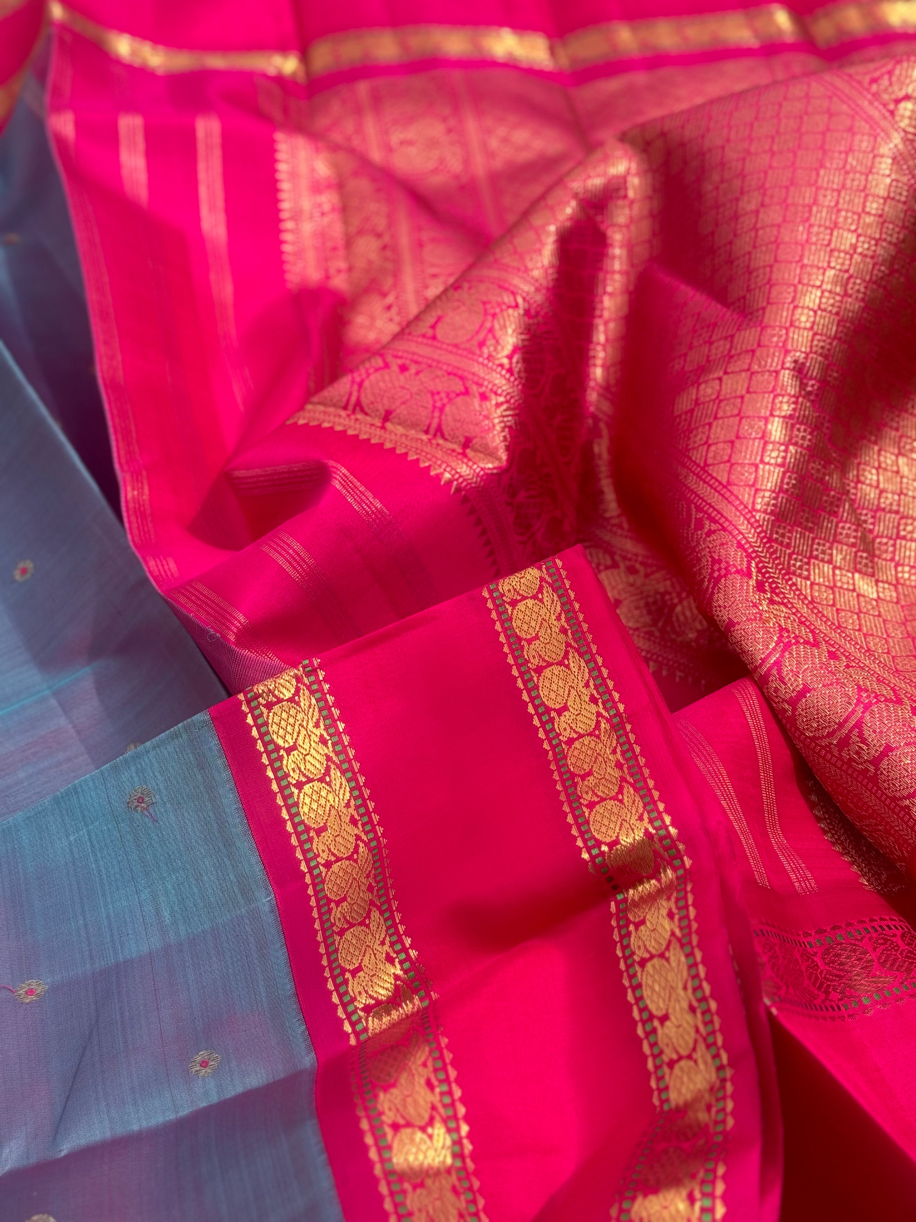 A Masterpiece kanchivaram korvai silk saree in peacock blue with pink