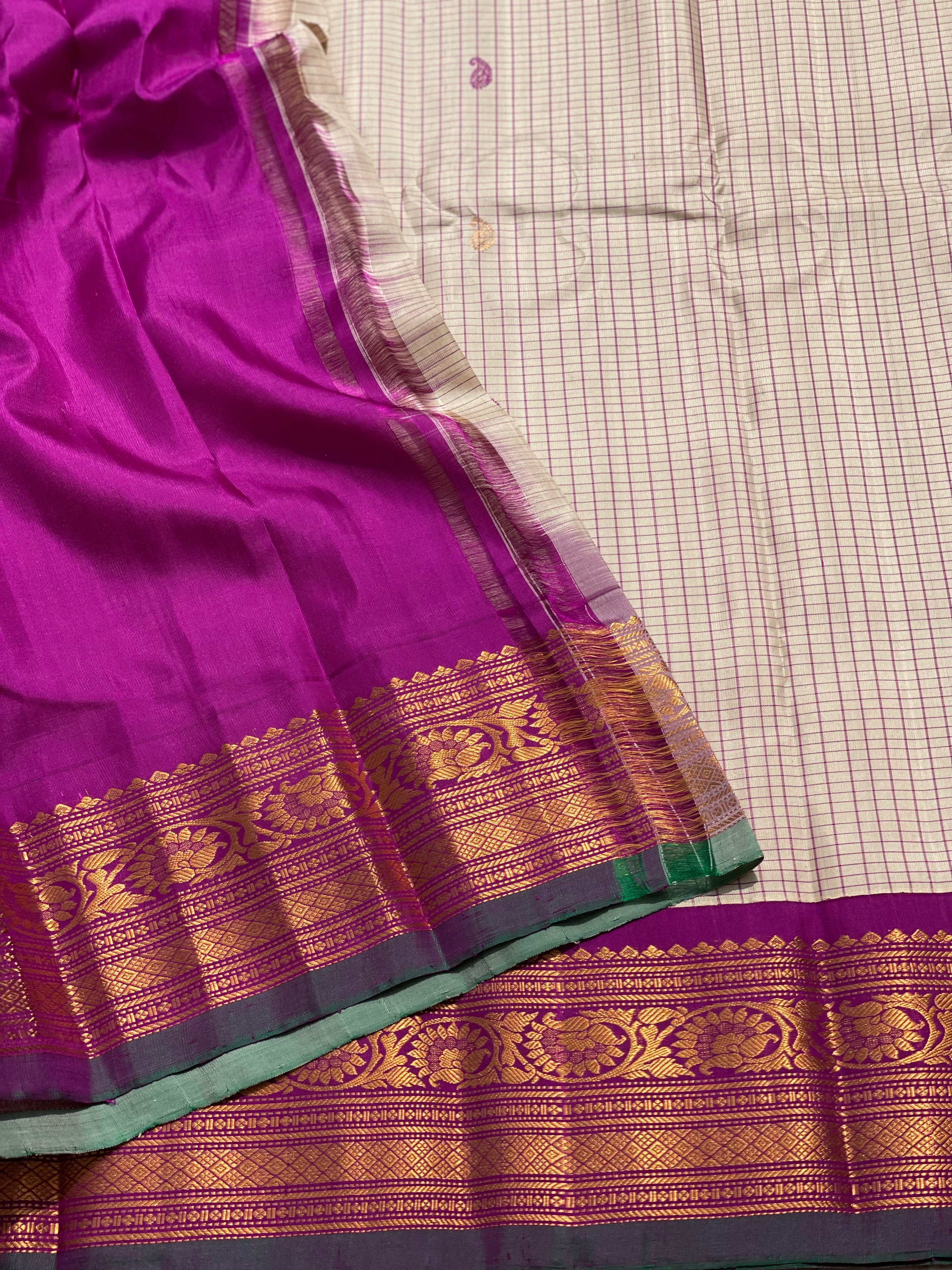 An elegant checks Pearl white with purple Gadwal silk saree