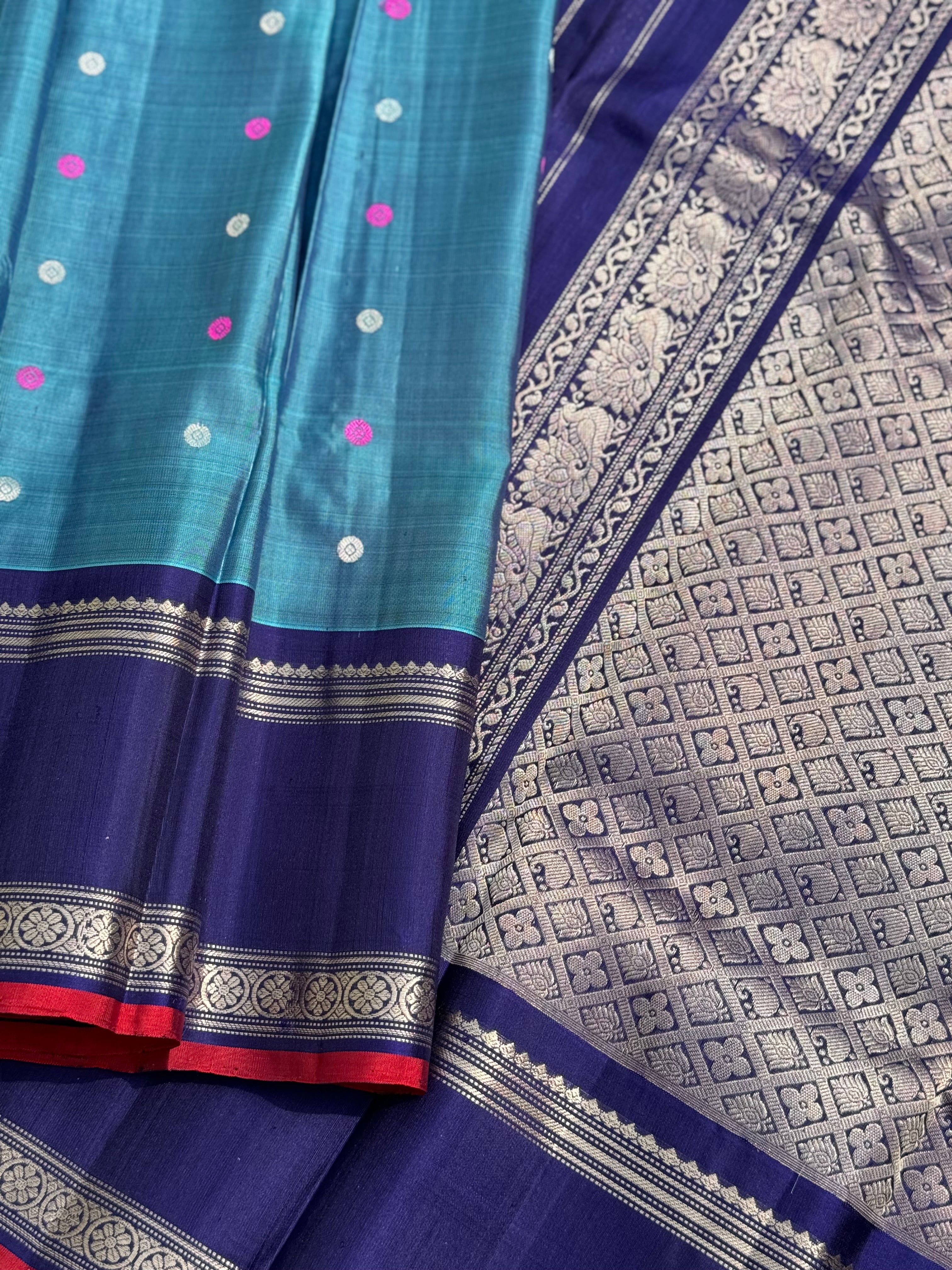 A gorgeous peacock teal handwoven gadwal silk saree