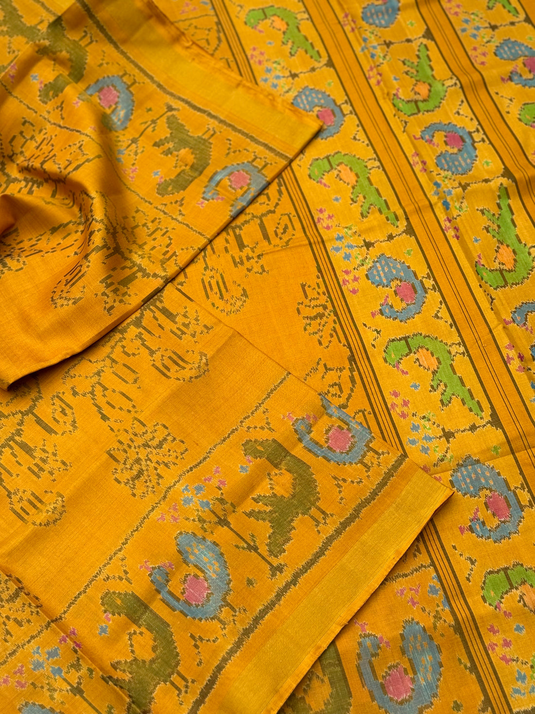 A gorgeous mustard yellow shade single ikkat patola silk SAREE