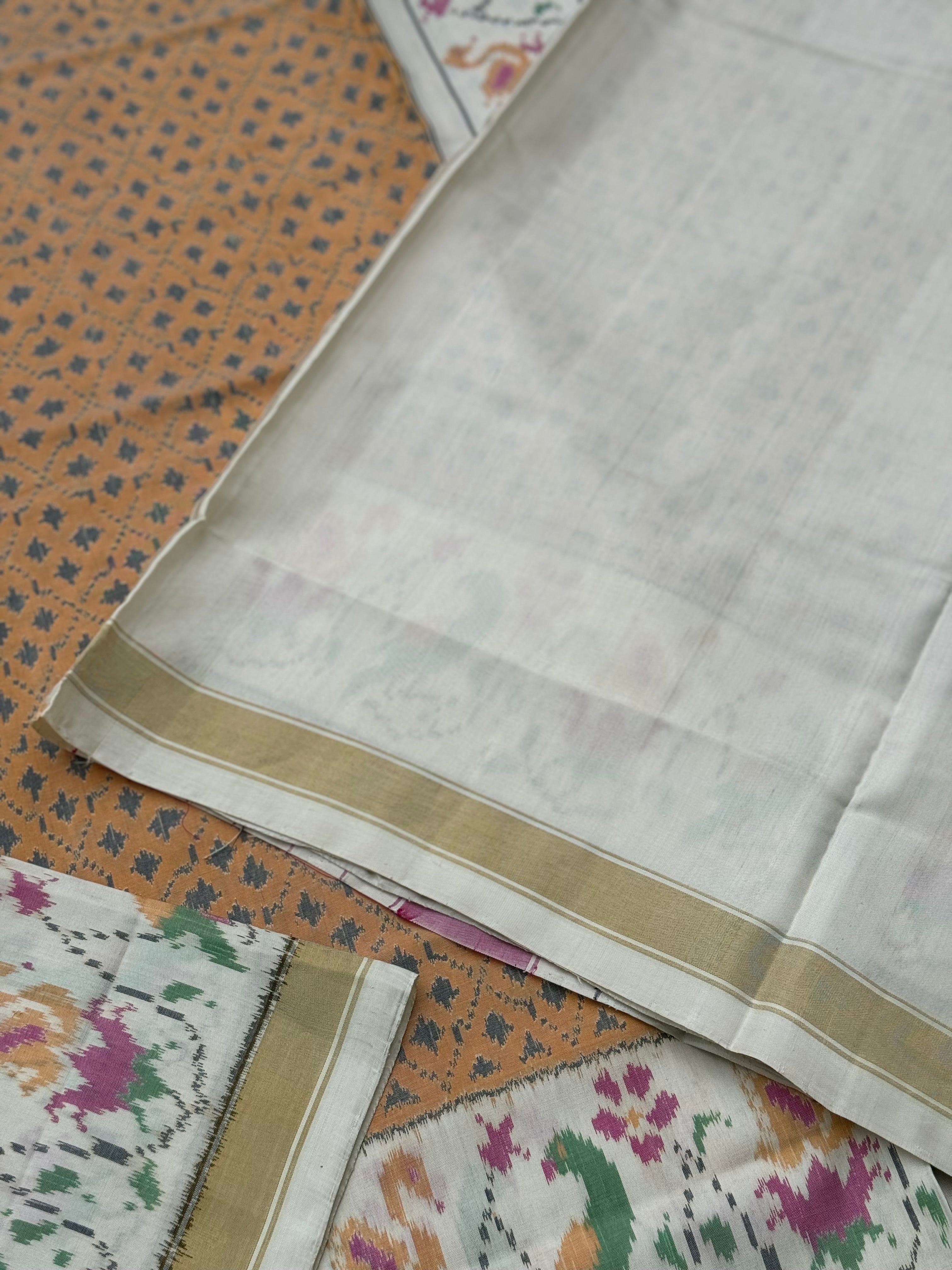 A gorgeous muted gold with offwhite single ikkat patola silk SAREE
