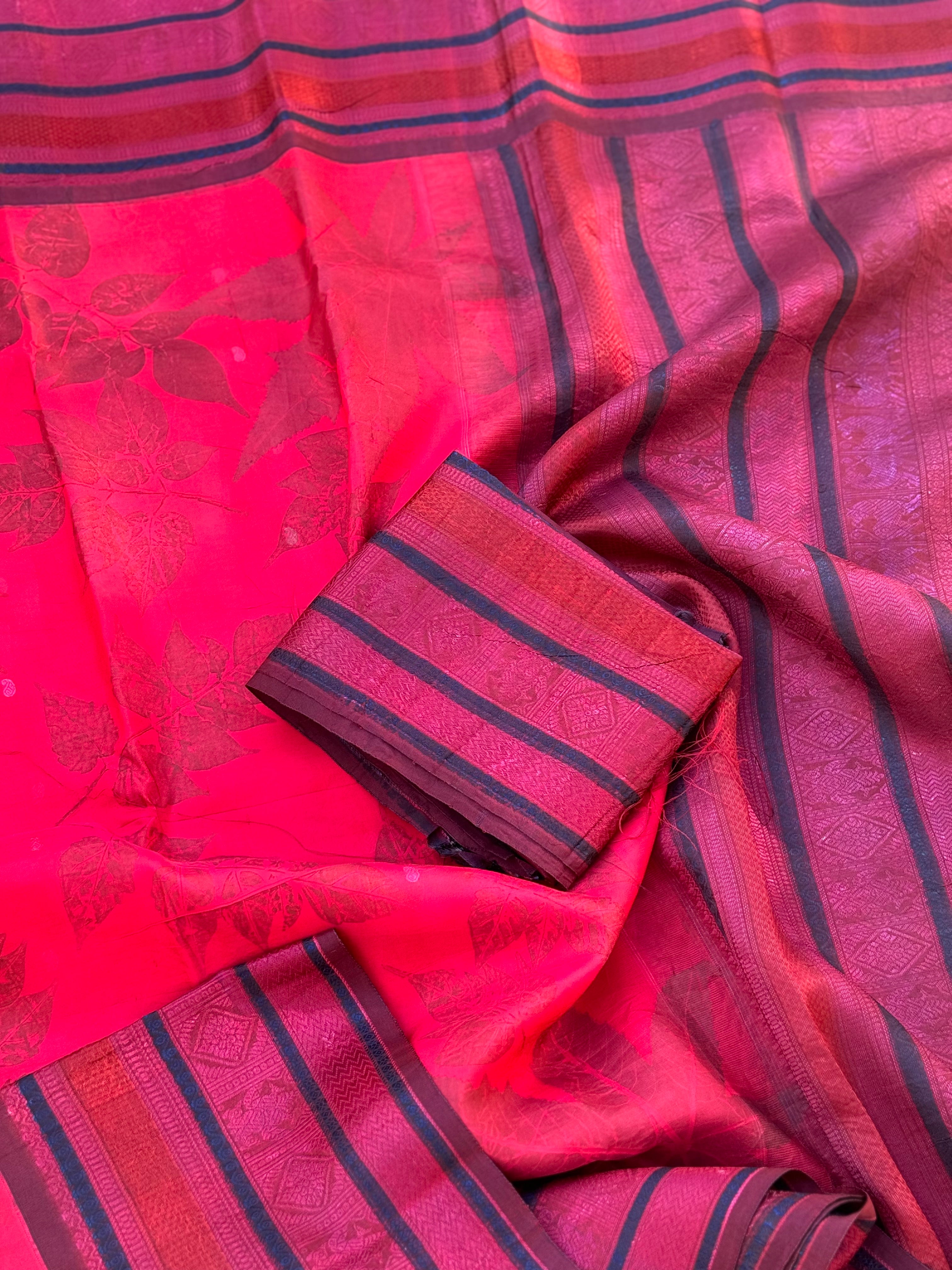 A stunningly gorgeous pinkish red threadwork kanchivaram silk saree with Ecoprints