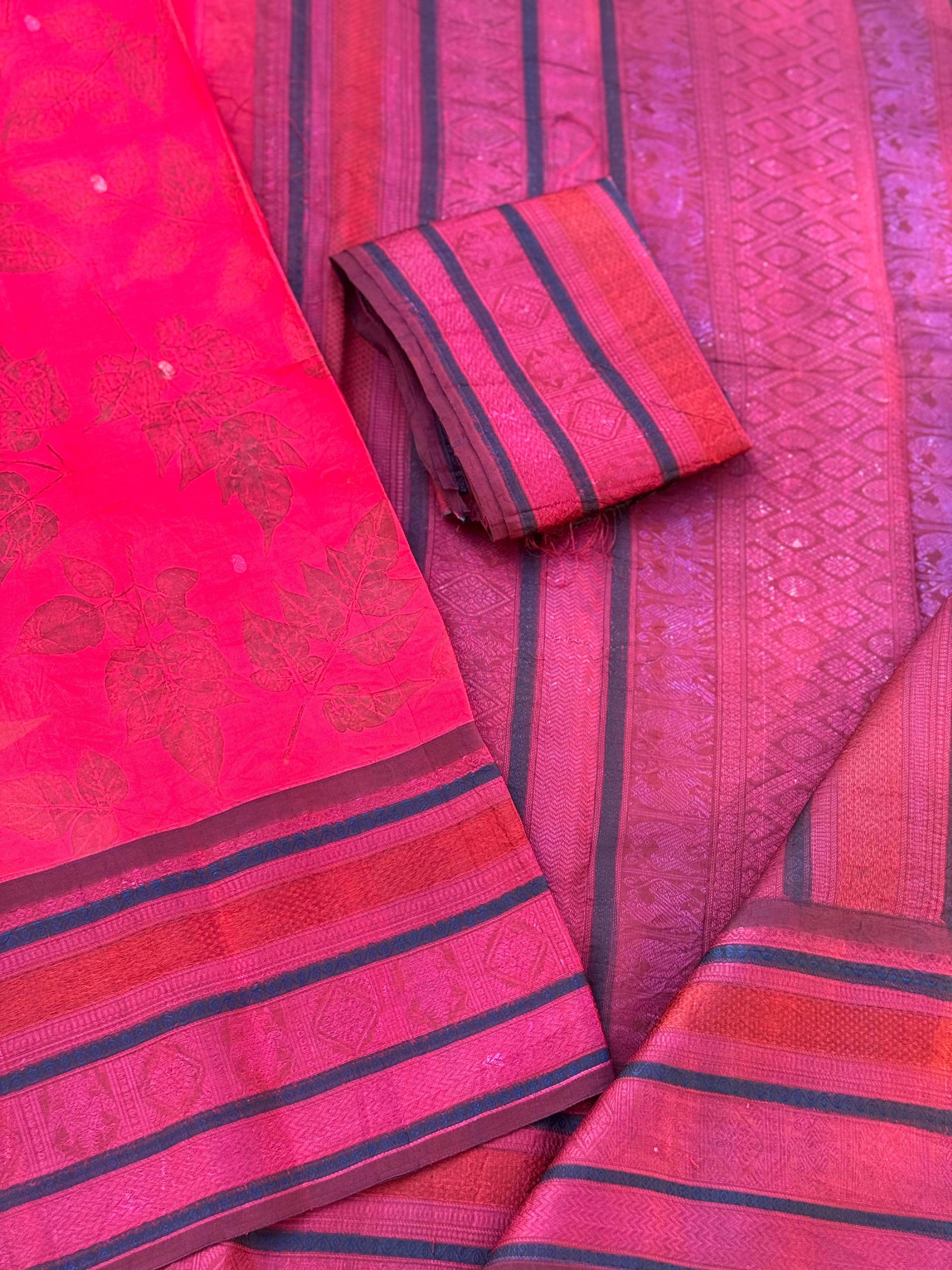 A stunningly gorgeous pinkish red threadwork kanchivaram silk saree with Ecoprints