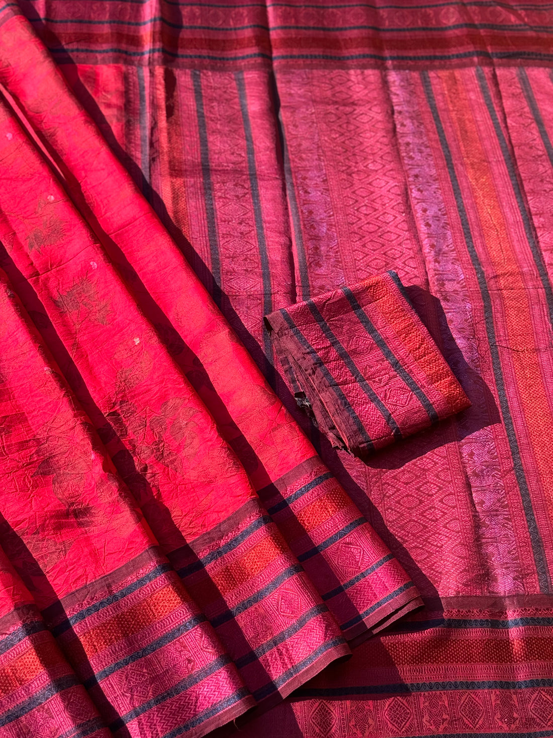 A stunningly gorgeous pinkish red threadwork kanchivaram silk saree with Ecoprints