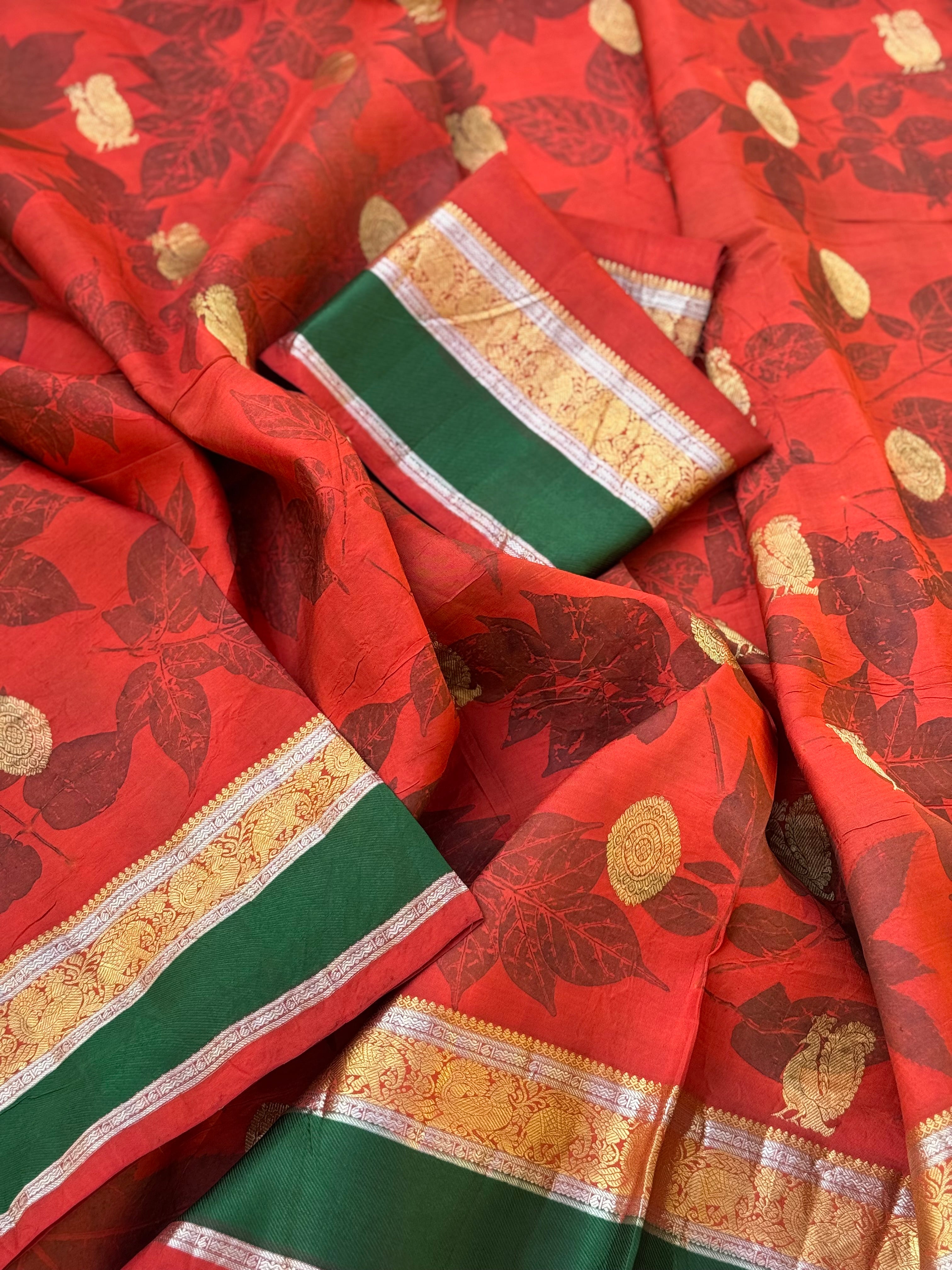 A stunningly gorgeous tomato red korvai kanchivaram silk saree with Ecoprints