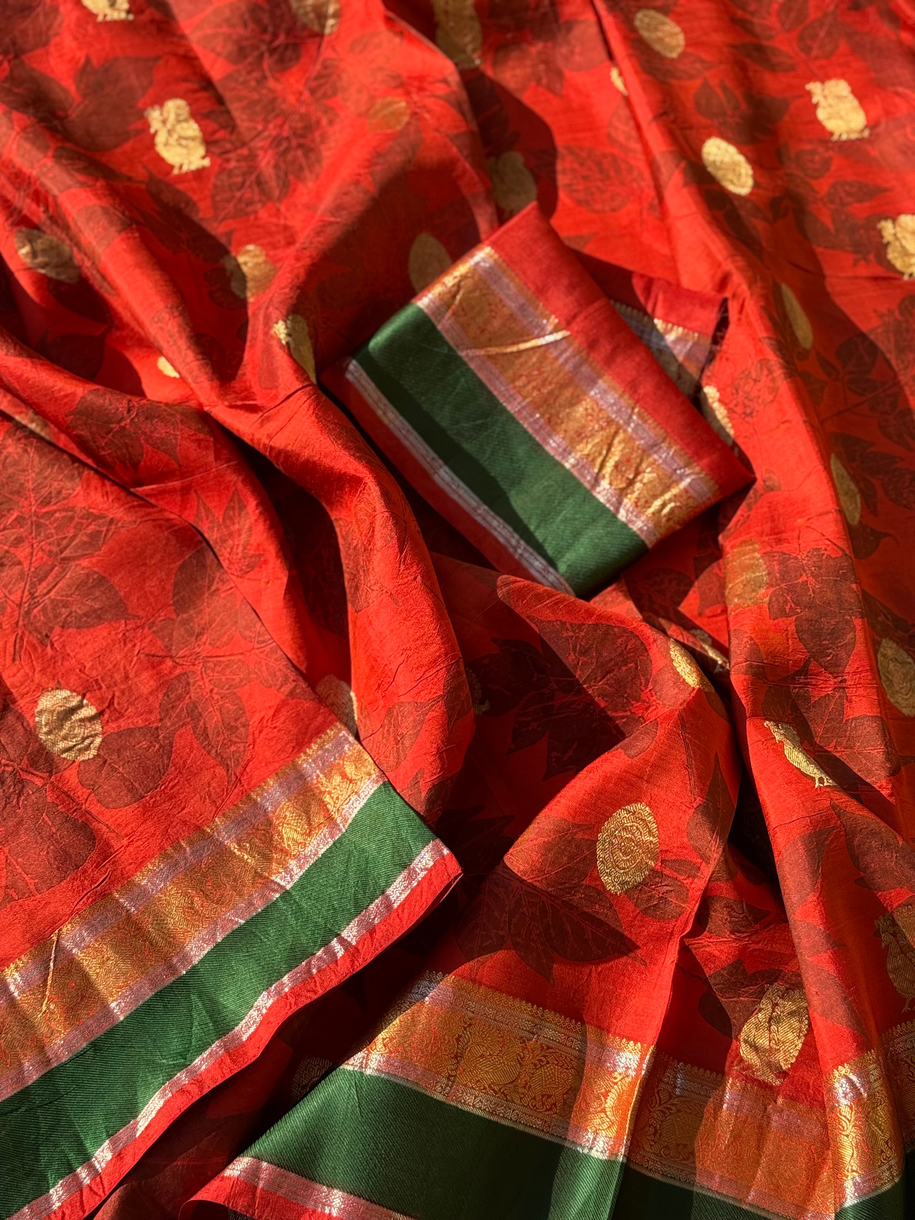 A stunningly gorgeous tomato red korvai kanchivaram silk saree with Ecoprints