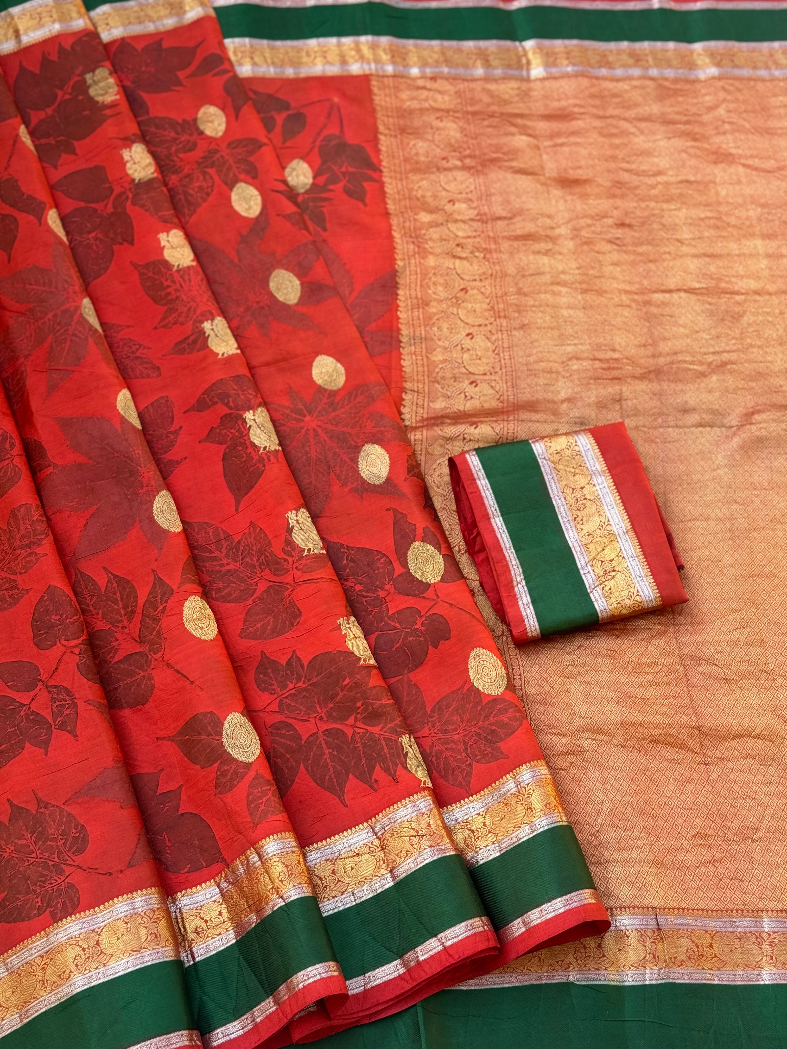 A stunningly gorgeous tomato red korvai kanchivaram silk saree with Ecoprints