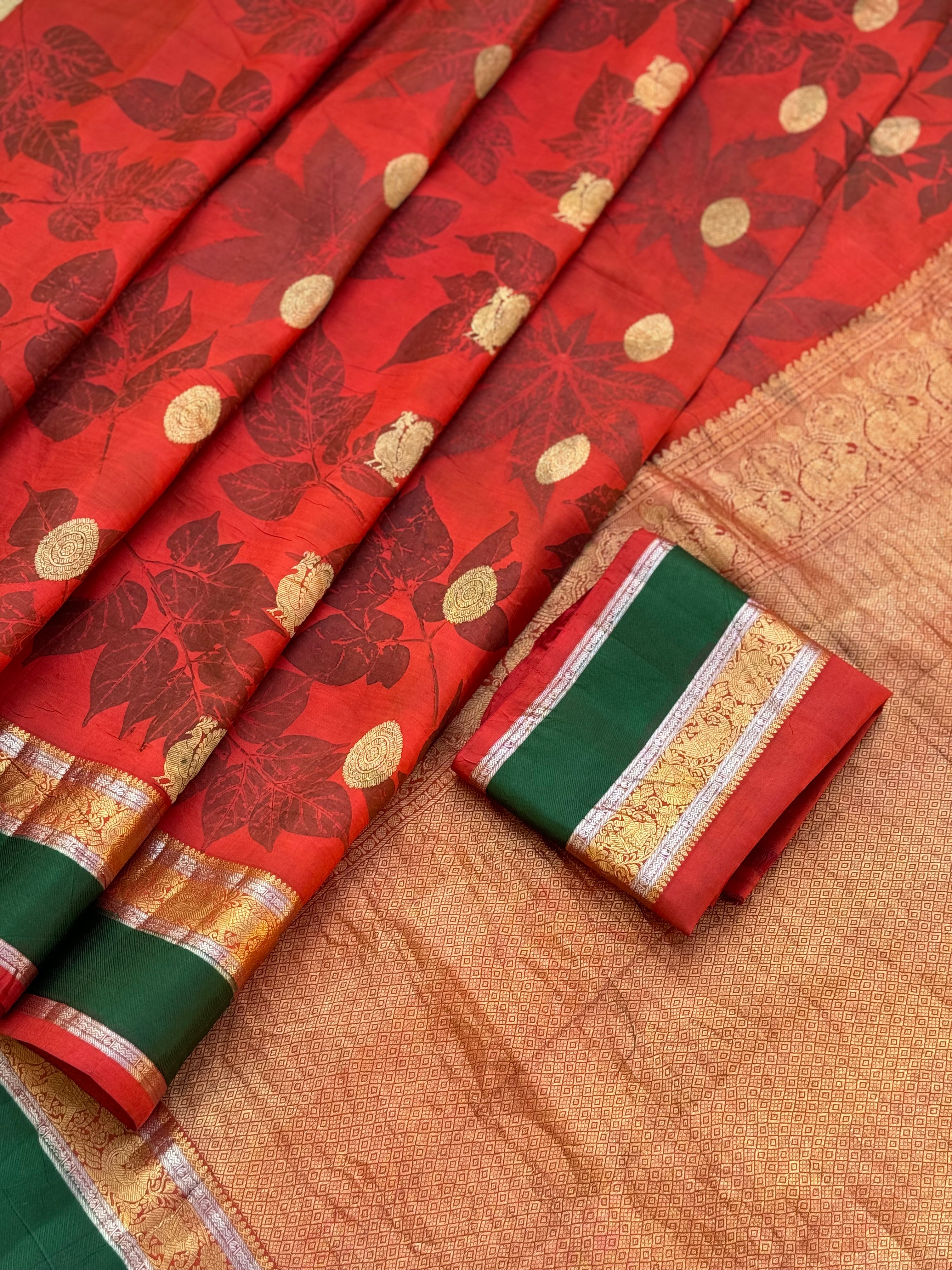 A stunningly gorgeous tomato red korvai kanchivaram silk saree with Ecoprints