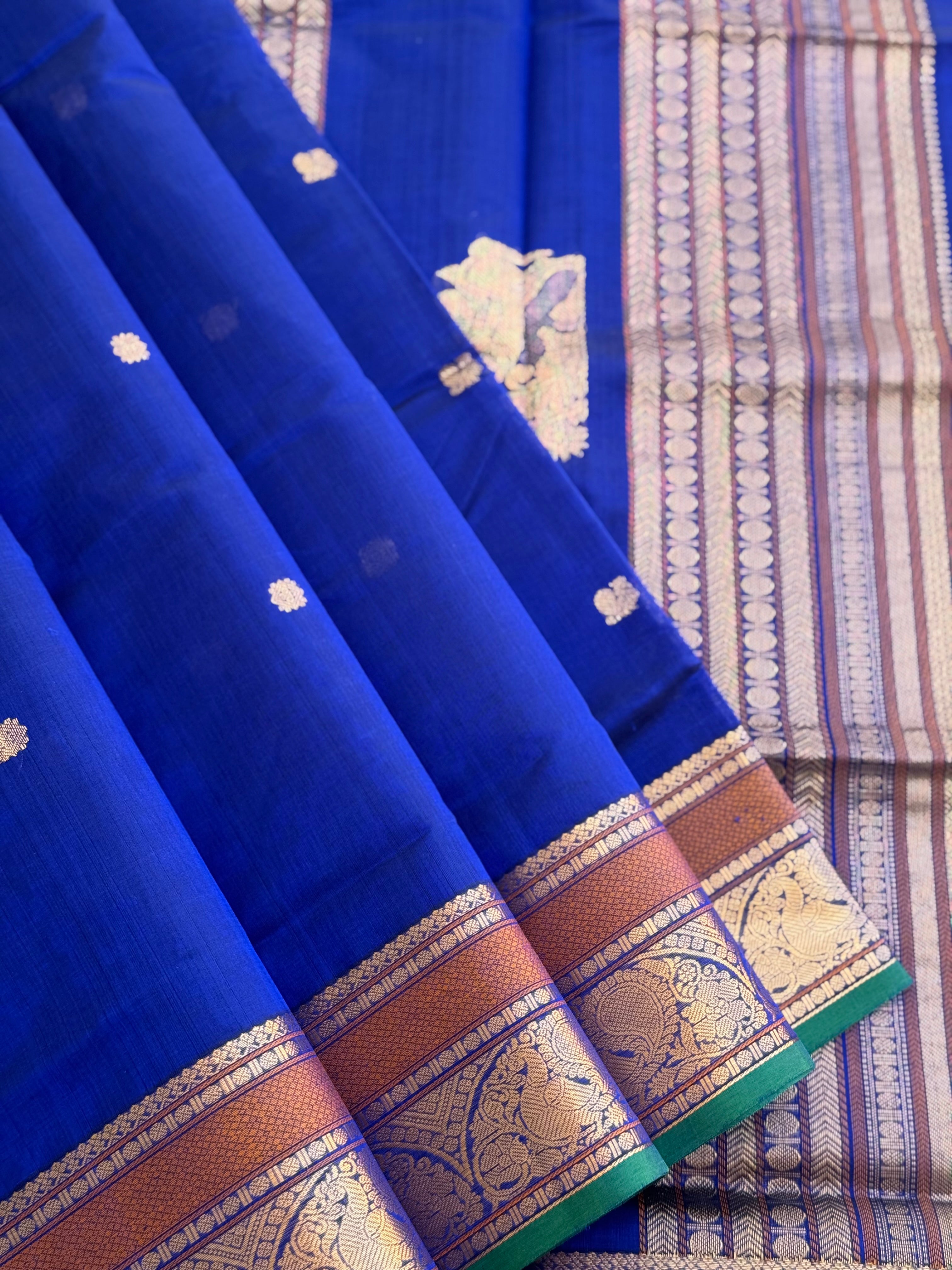 Ms blue Kanchi silk cotton saree with conia buttas