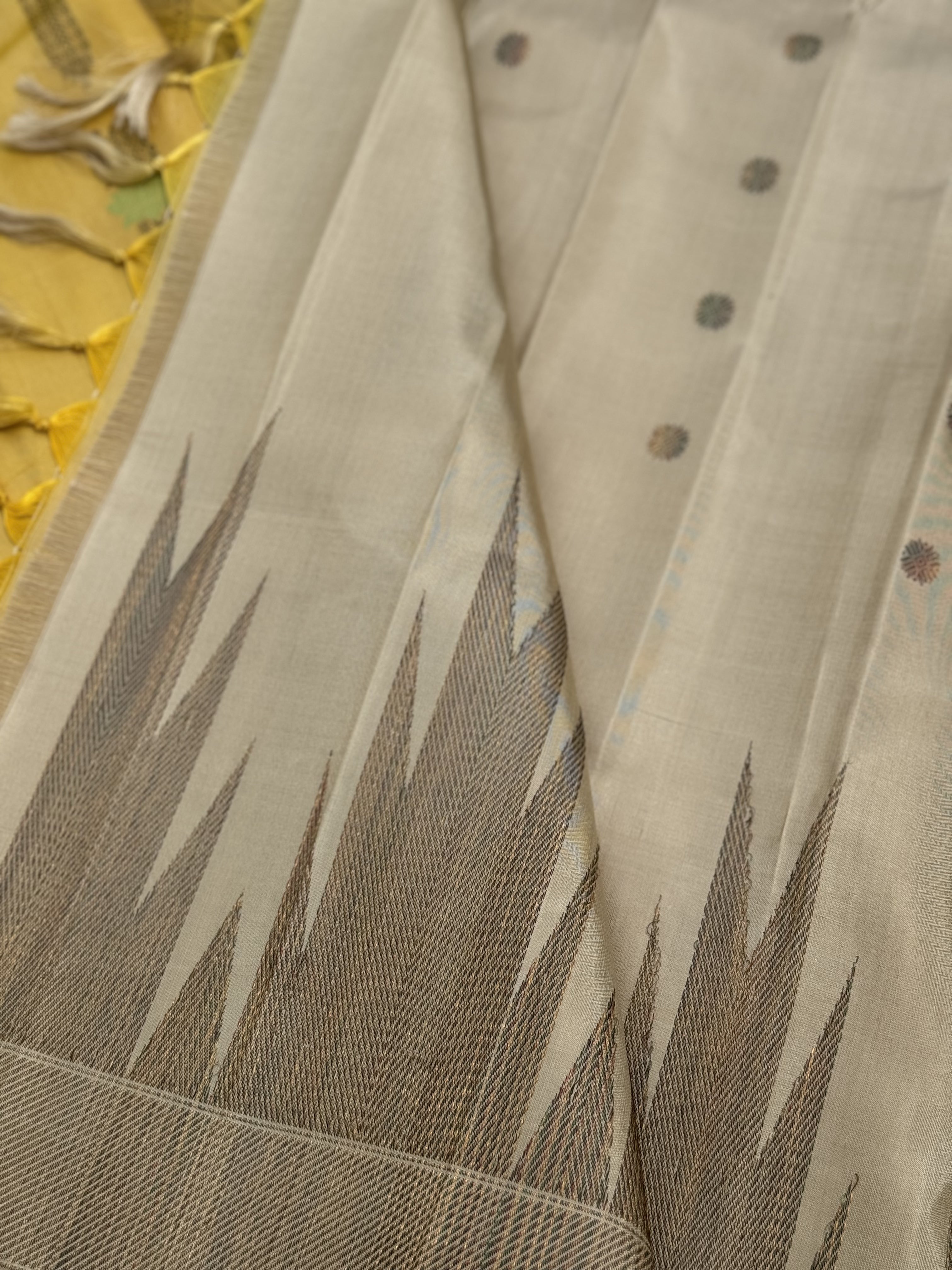 A gorgeous pastel yellow handwoven soft and lustrous temple woven gadwal silk saree