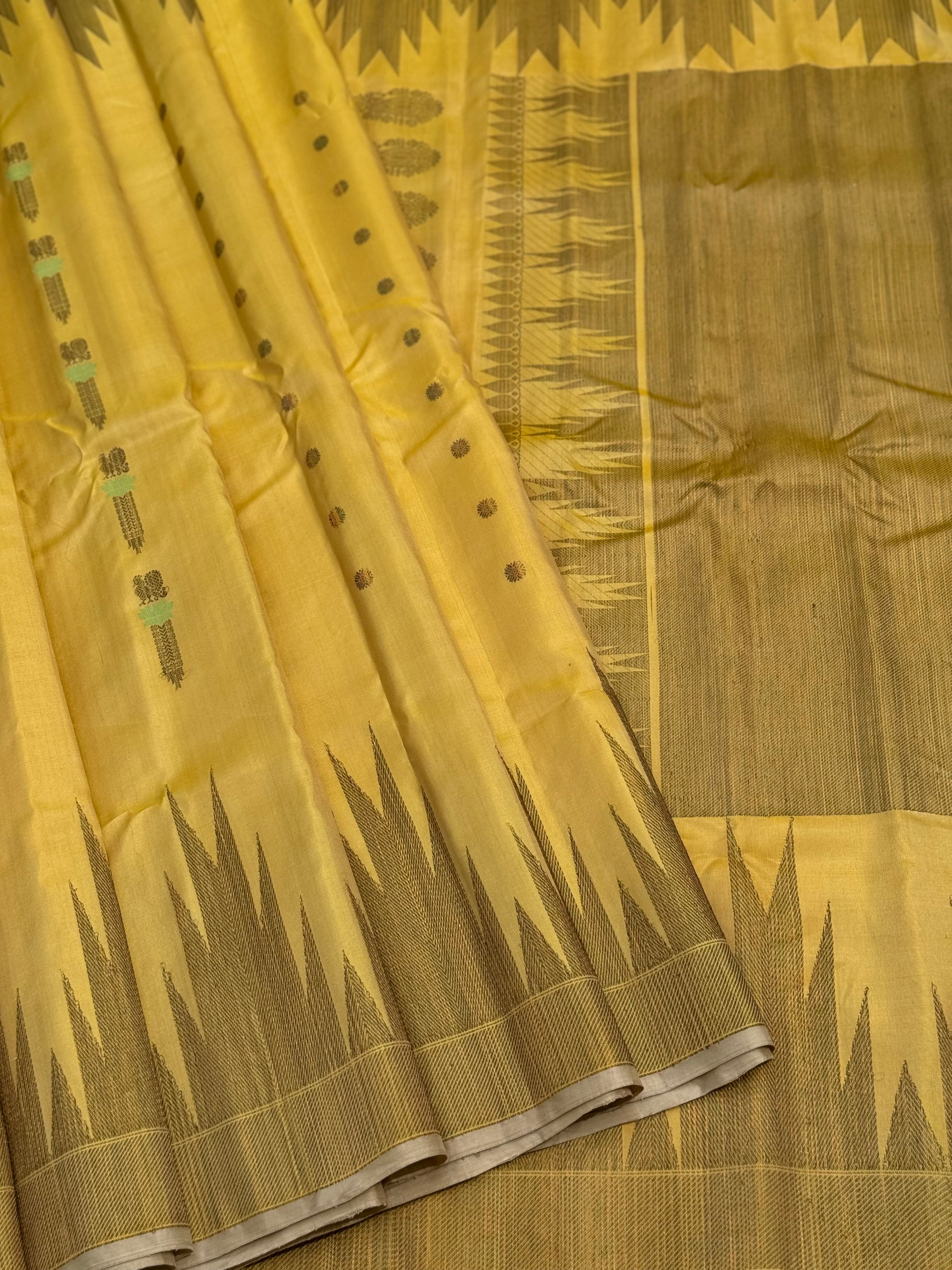 A gorgeous pastel yellow handwoven soft and lustrous temple woven gadwal silk saree