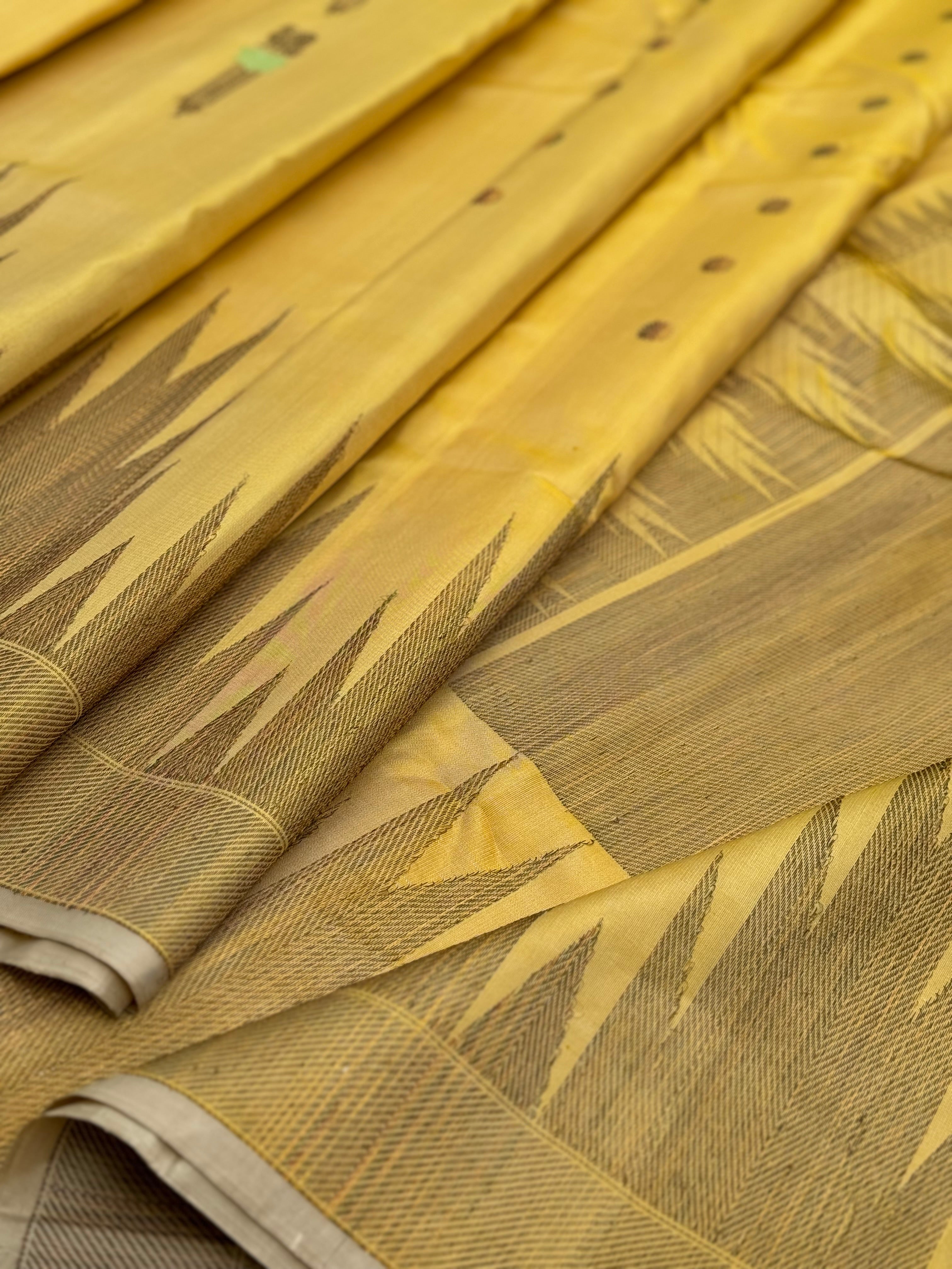 A gorgeous pastel yellow handwoven soft and lustrous temple woven gadwal silk saree