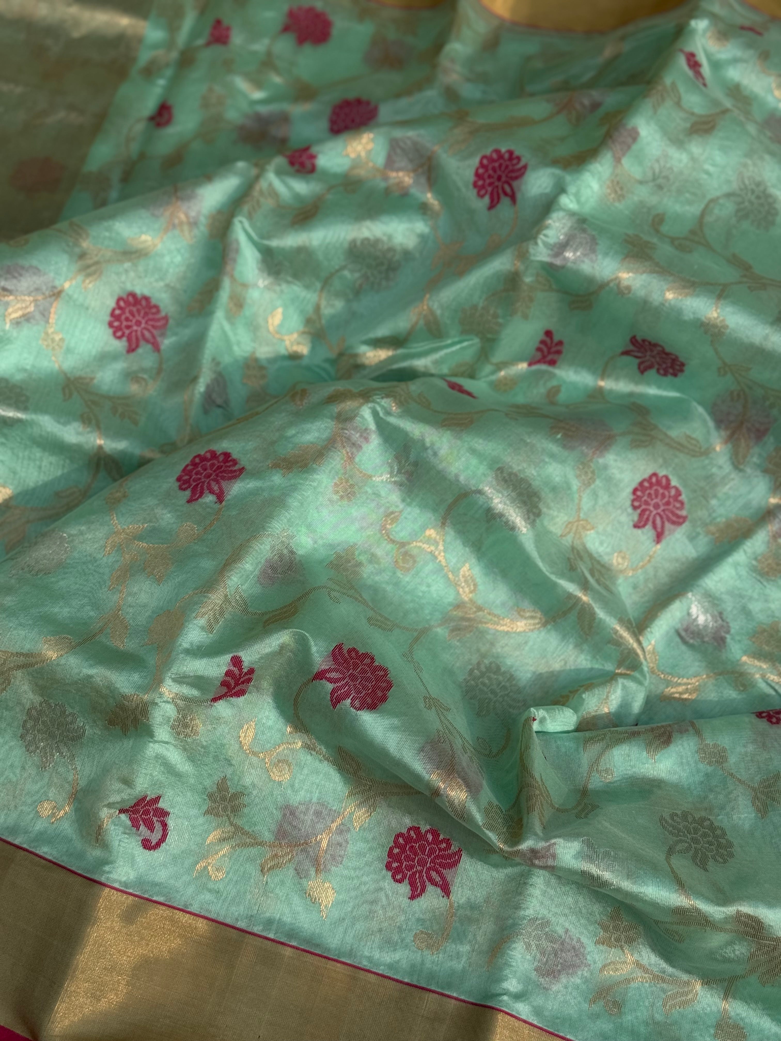 A foam green handwoven chanderi silk saree with full jaal weave ek naal and meenakari