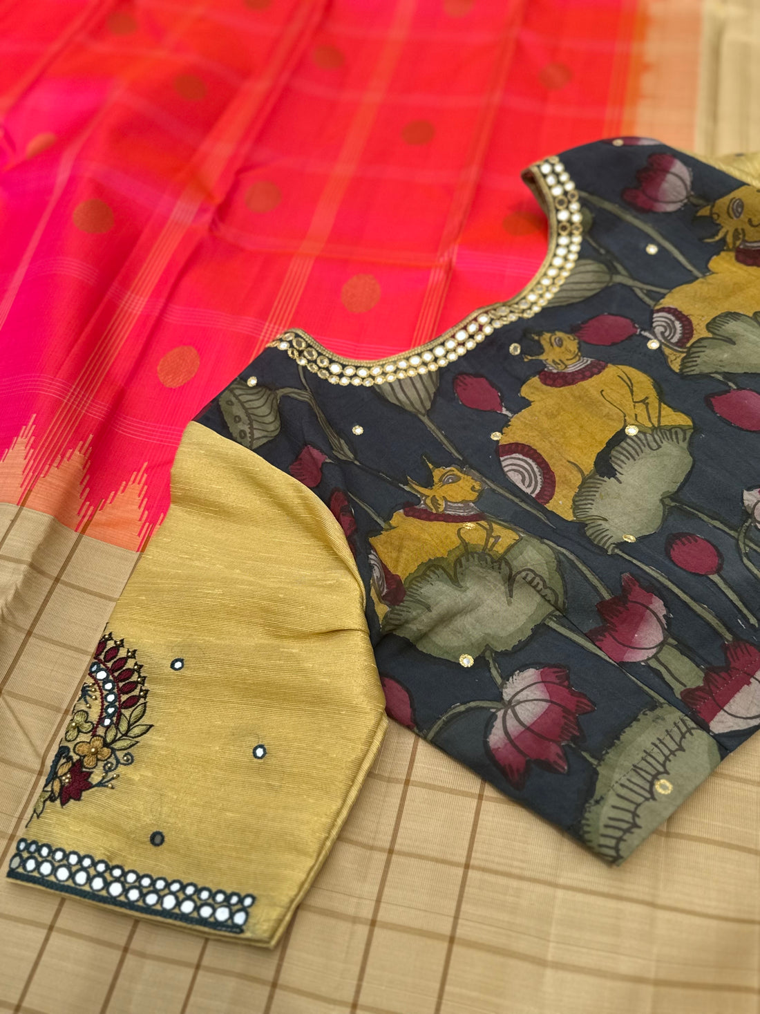 The raw silk tissue gold shade penkalamkari blouse with mirror embroidered work