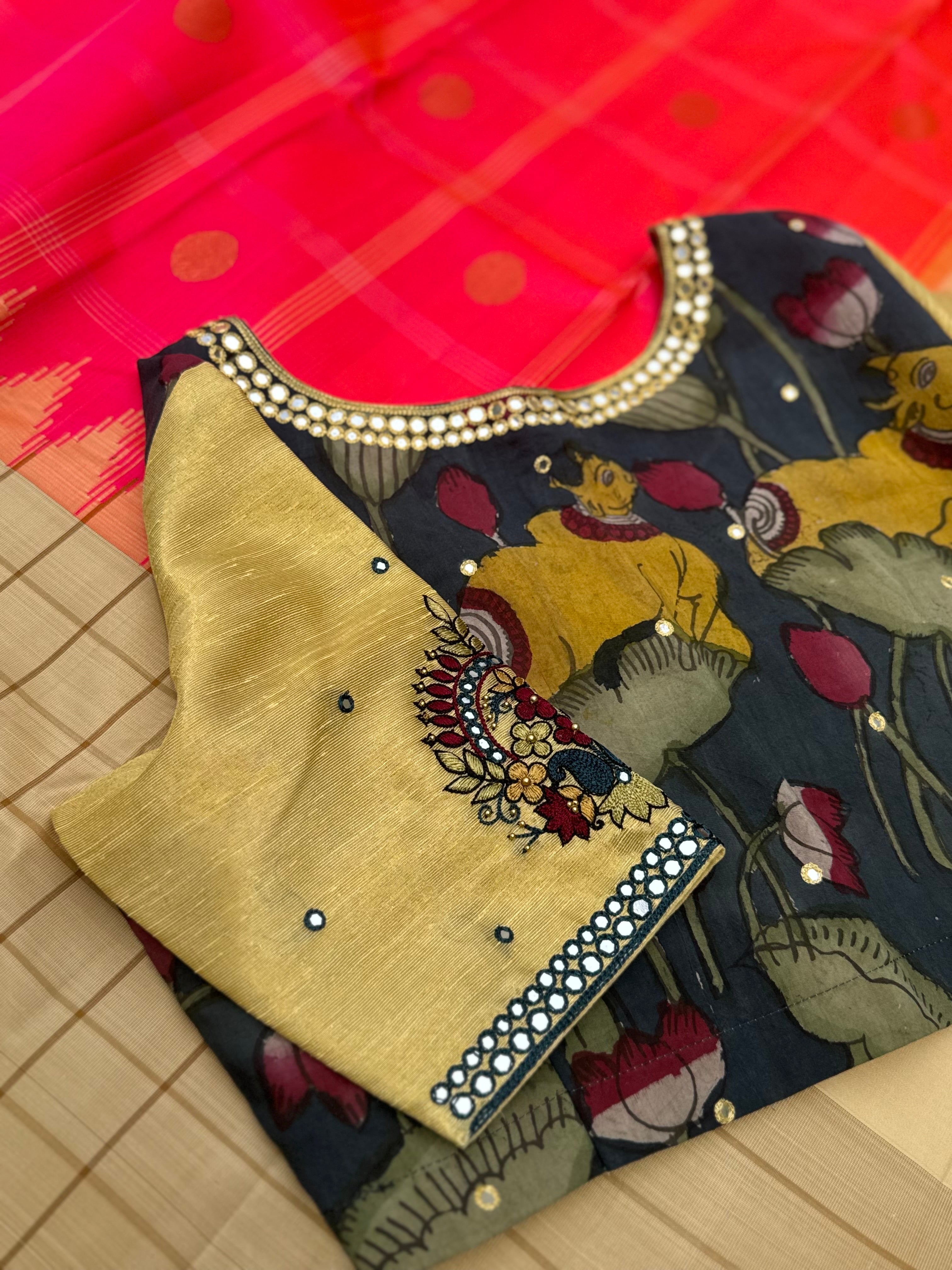 The raw silk tissue gold shade penkalamkari blouse with mirror embroidered work