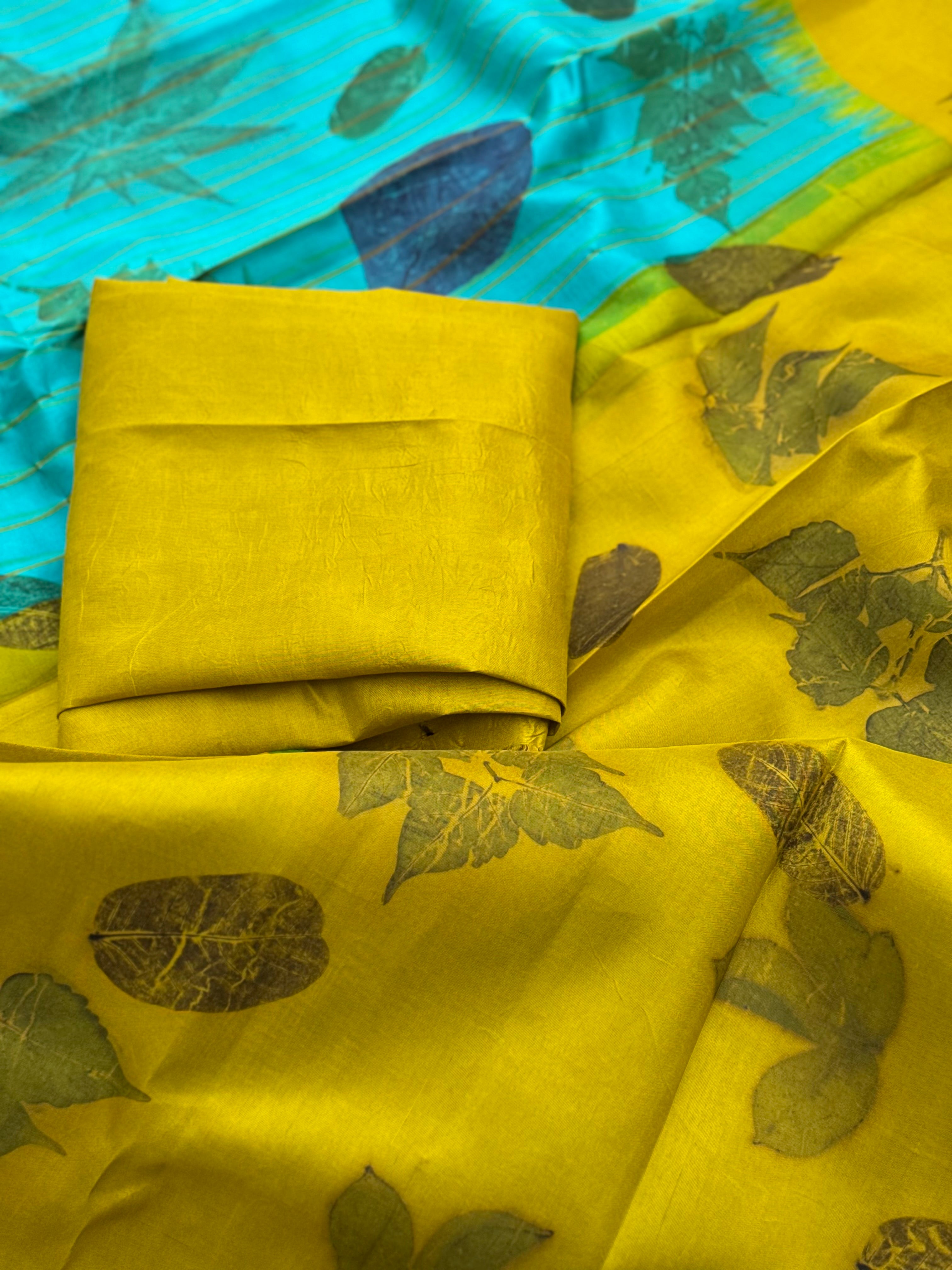 A gorgeous natural ecoprints done on foam blue with yellow kuttu gadwal silk saree