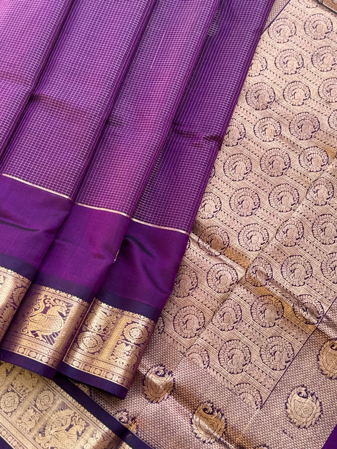 A gorgeous purple shade handwoven Oosi zari checks kanchi silk cotton saree