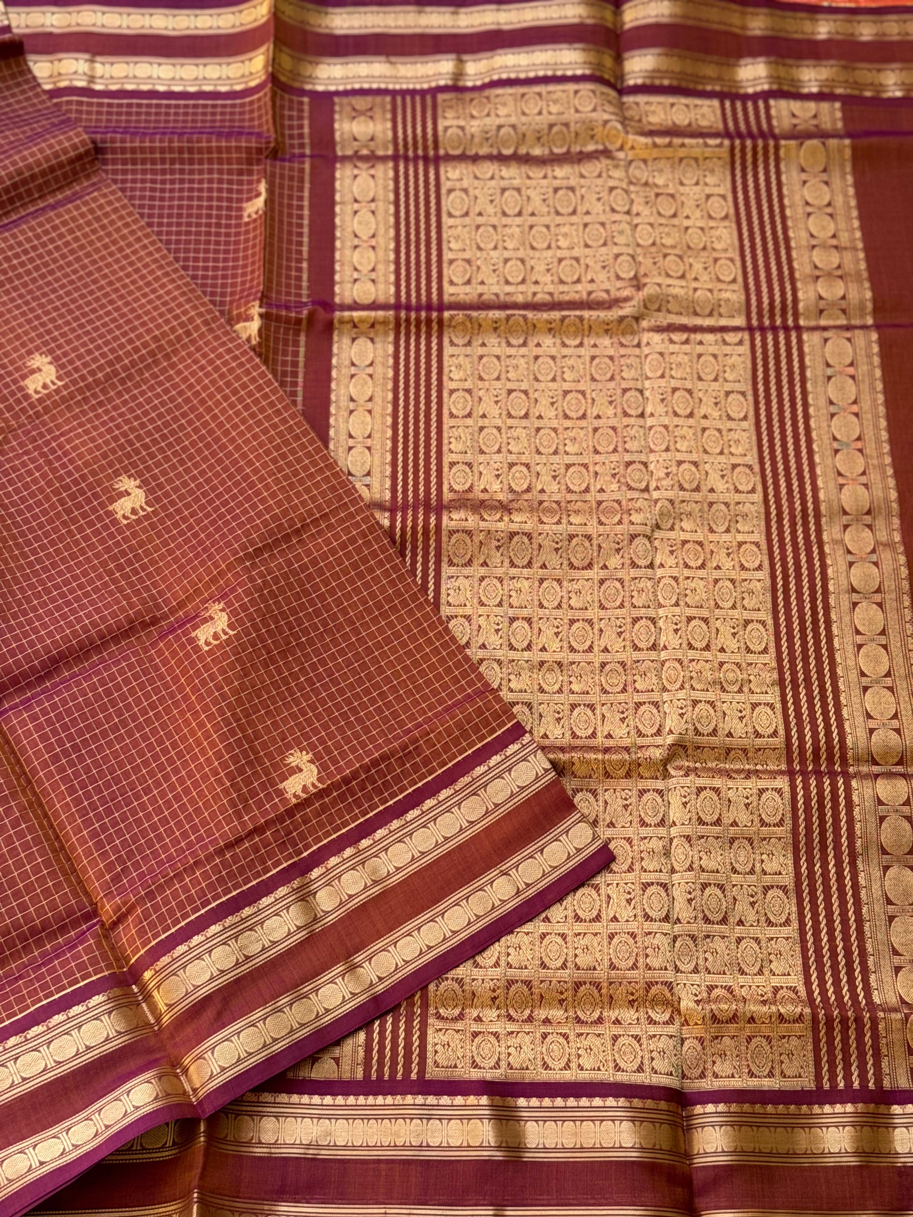 A gorgeous rust brown shade handwoven zari stripes kanchi silk cotton saree