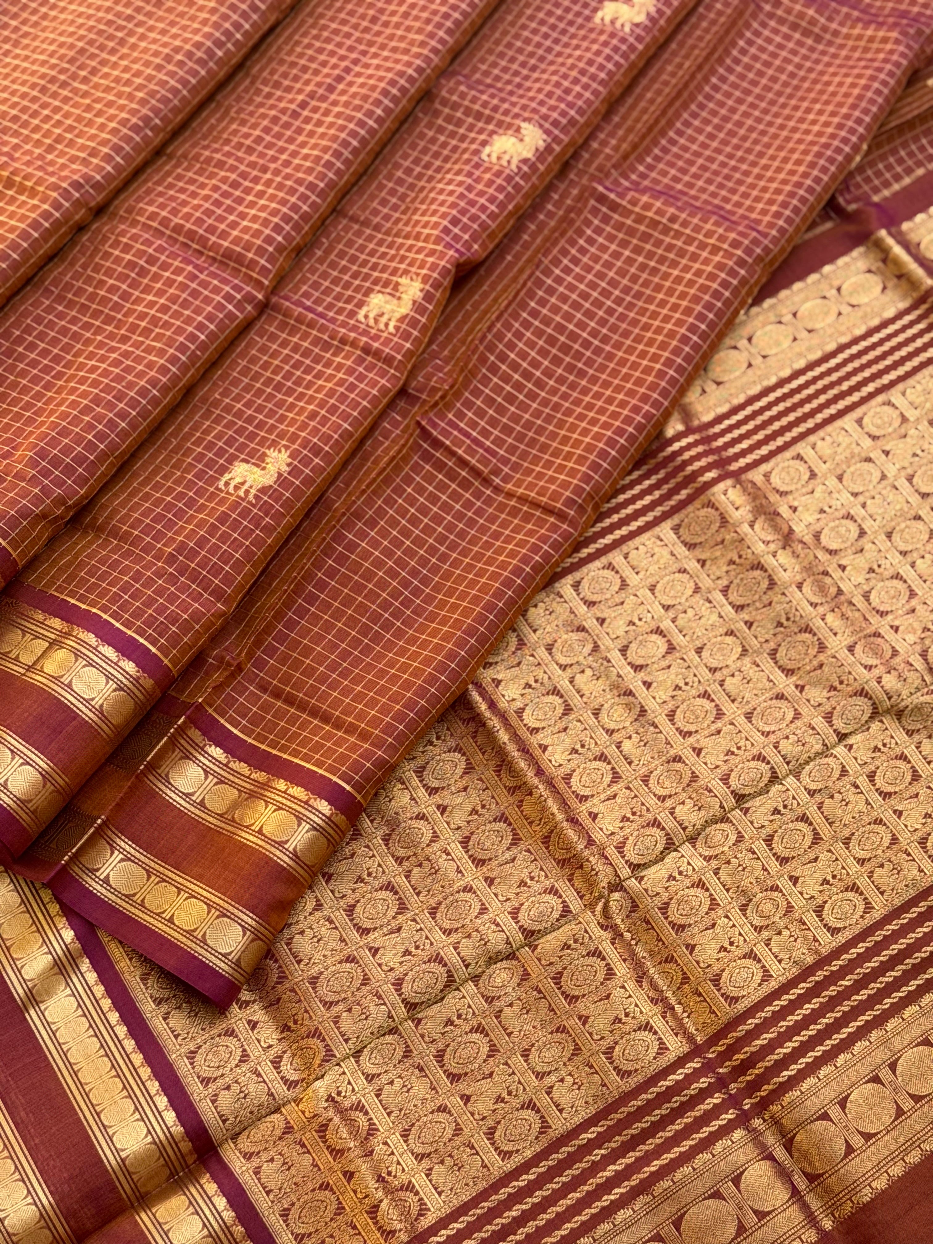 A gorgeous rust brown shade handwoven zari stripes kanchi silk cotton saree