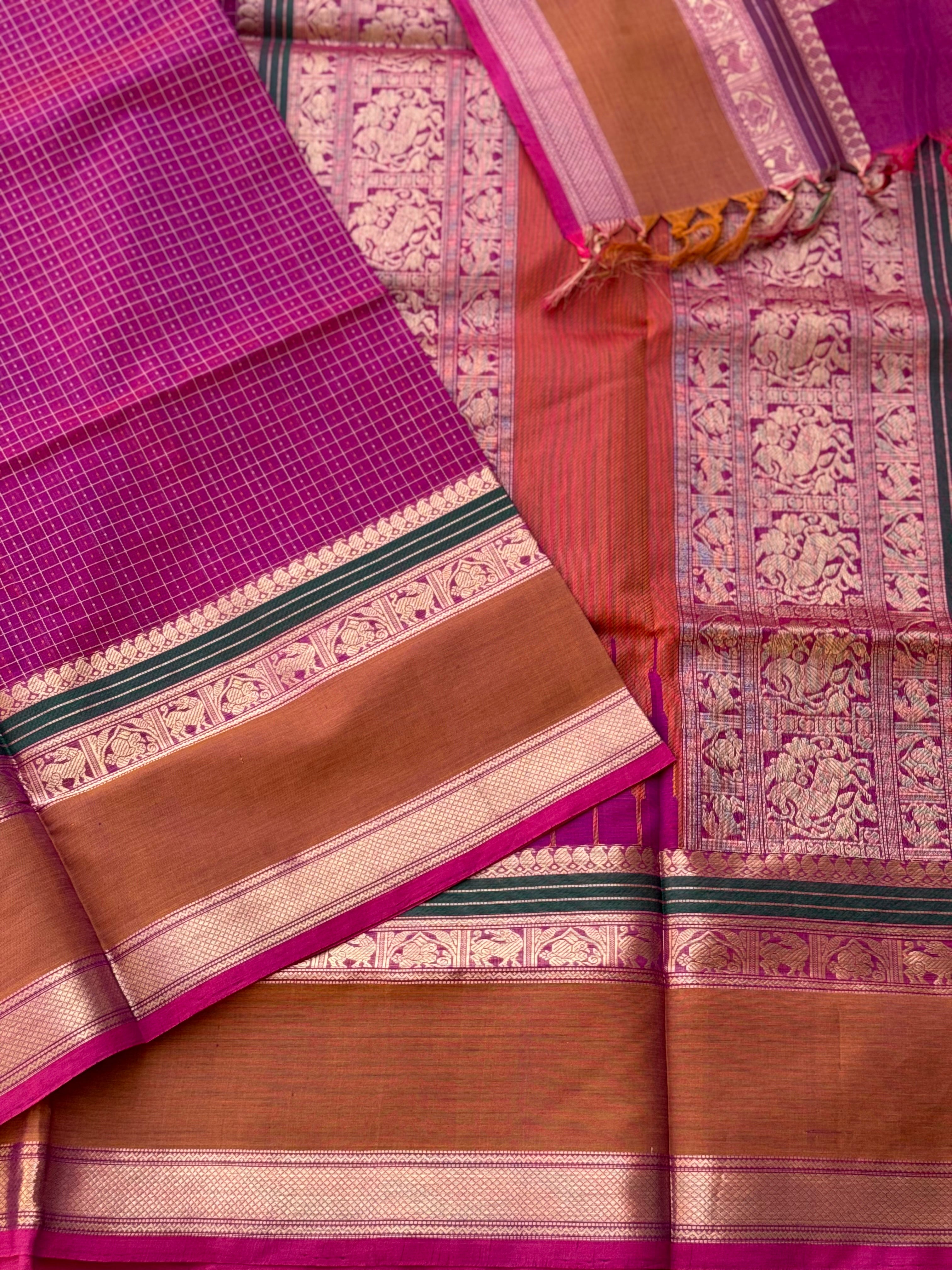 A gorgeous deep pink with lakhshadeepam buttas silk cotton saree