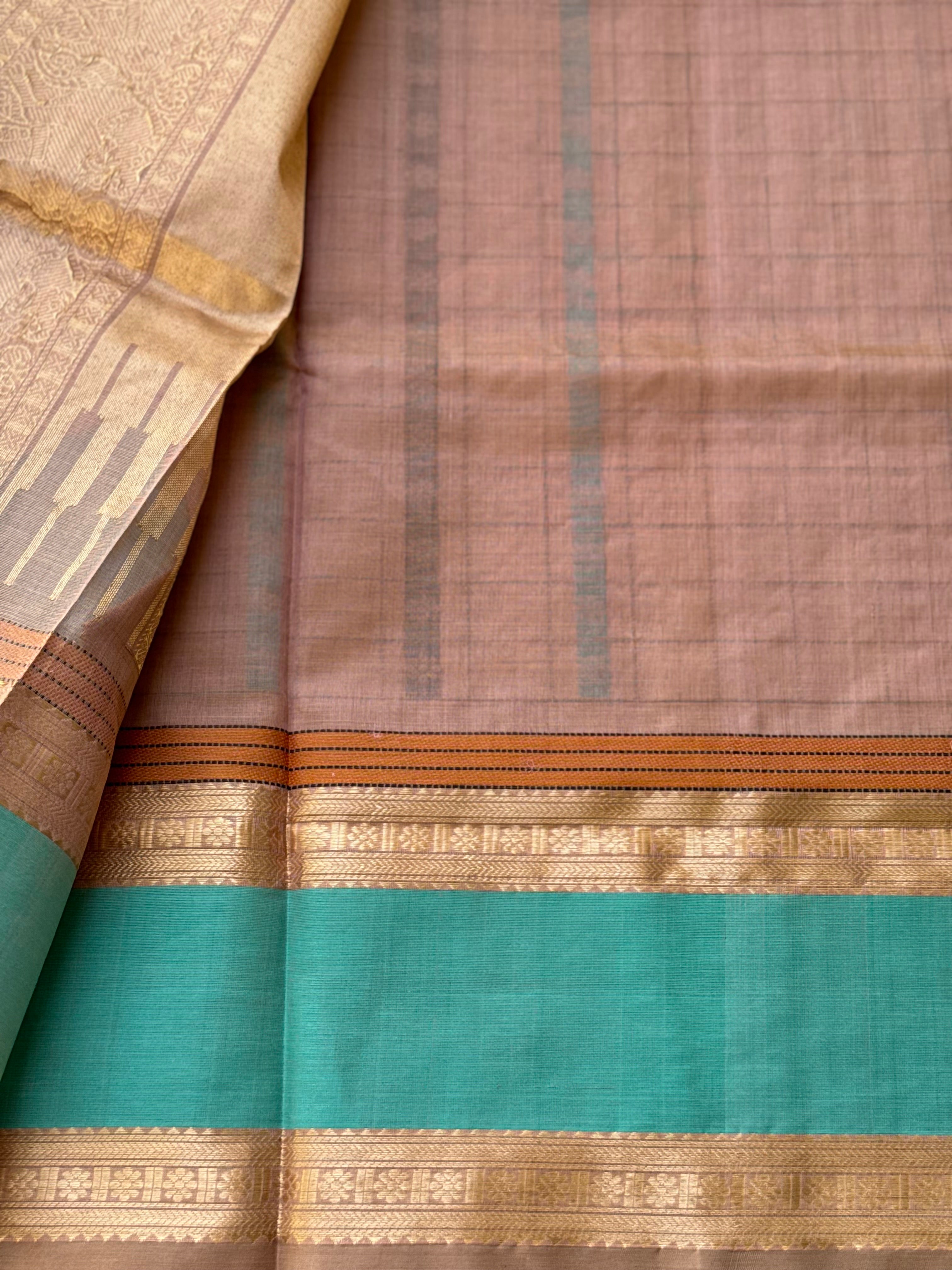 A beautiful 1000 buttas foam green shade kanchi silk cotton saree