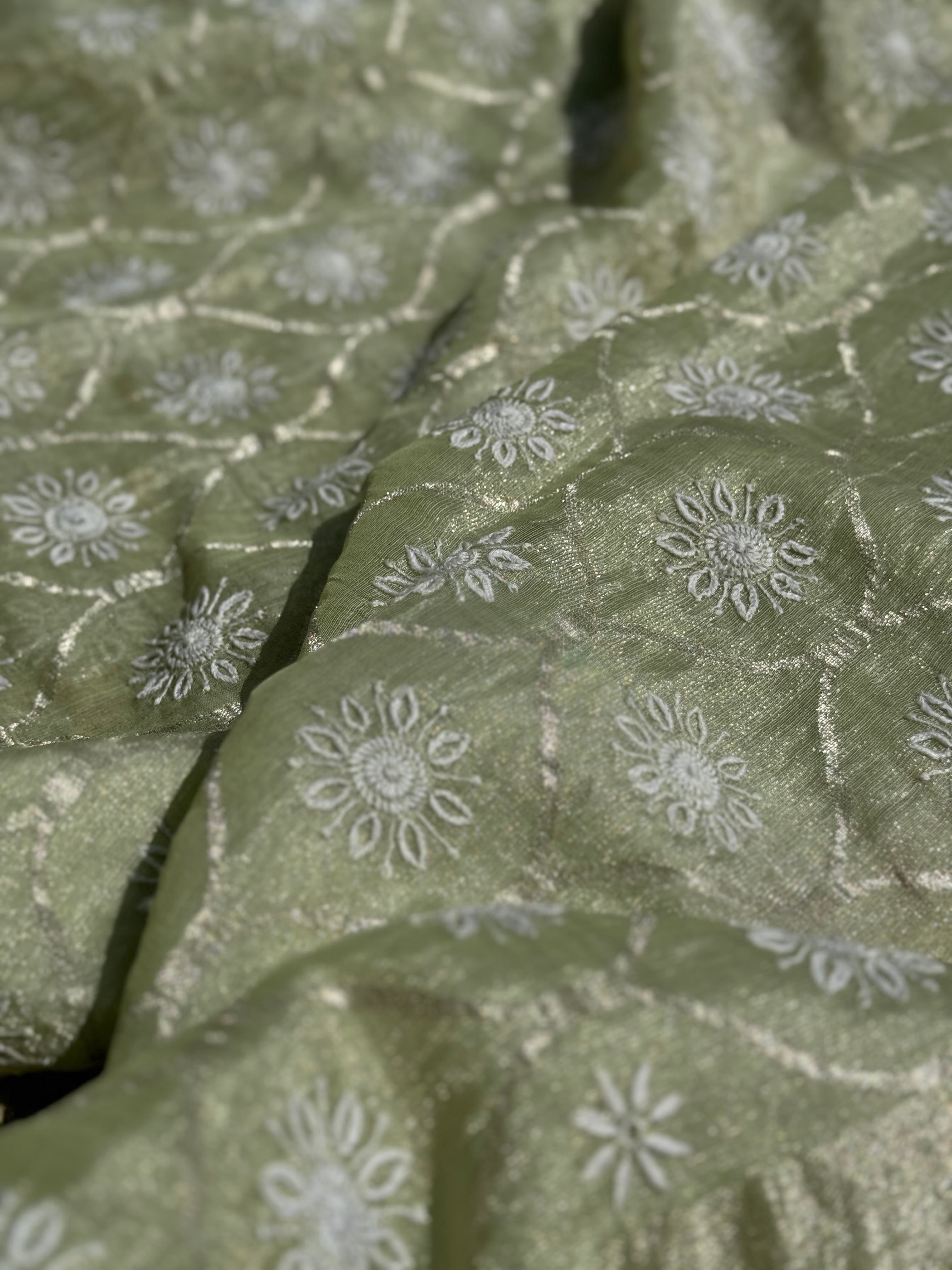 A stunner exclusive designer collective Matcha green all over Chikankari work on handwoven tissue silk
