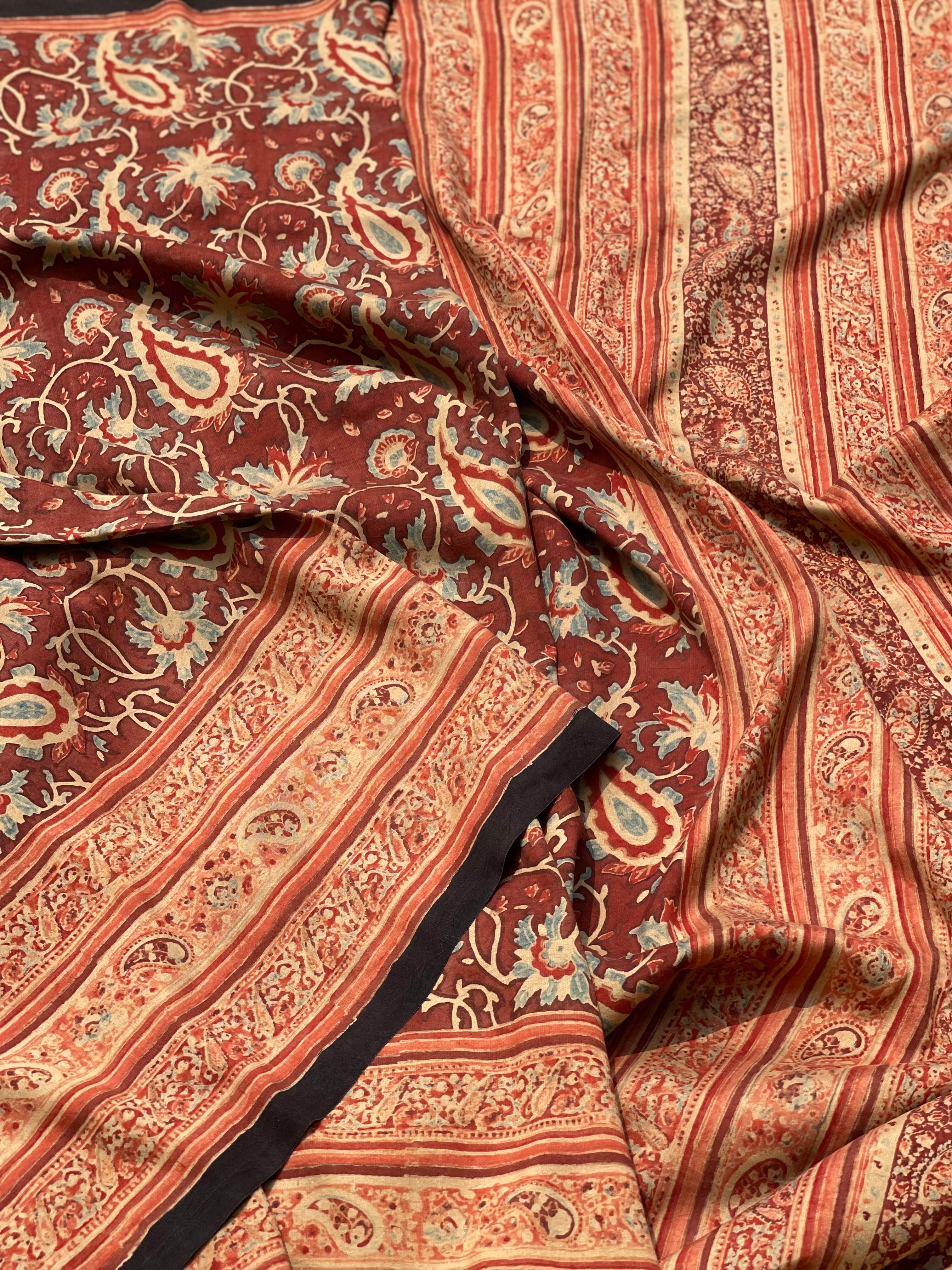 A double layered / double resist Handblock printed Ajrakh on heavy silk saree