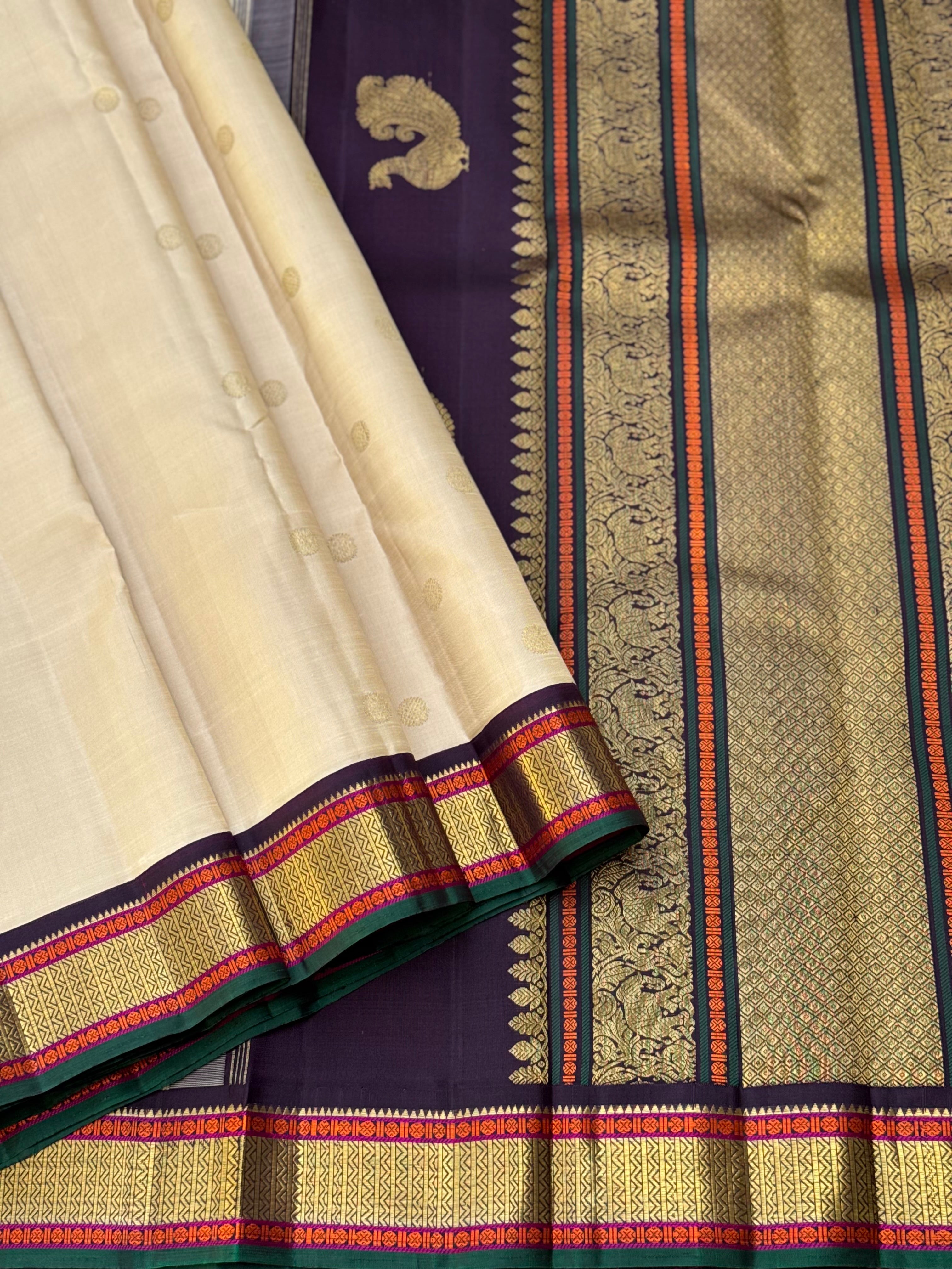 An elegant ivory with betel nut shade korvai kanchivaram silk saree with kamalam motifs