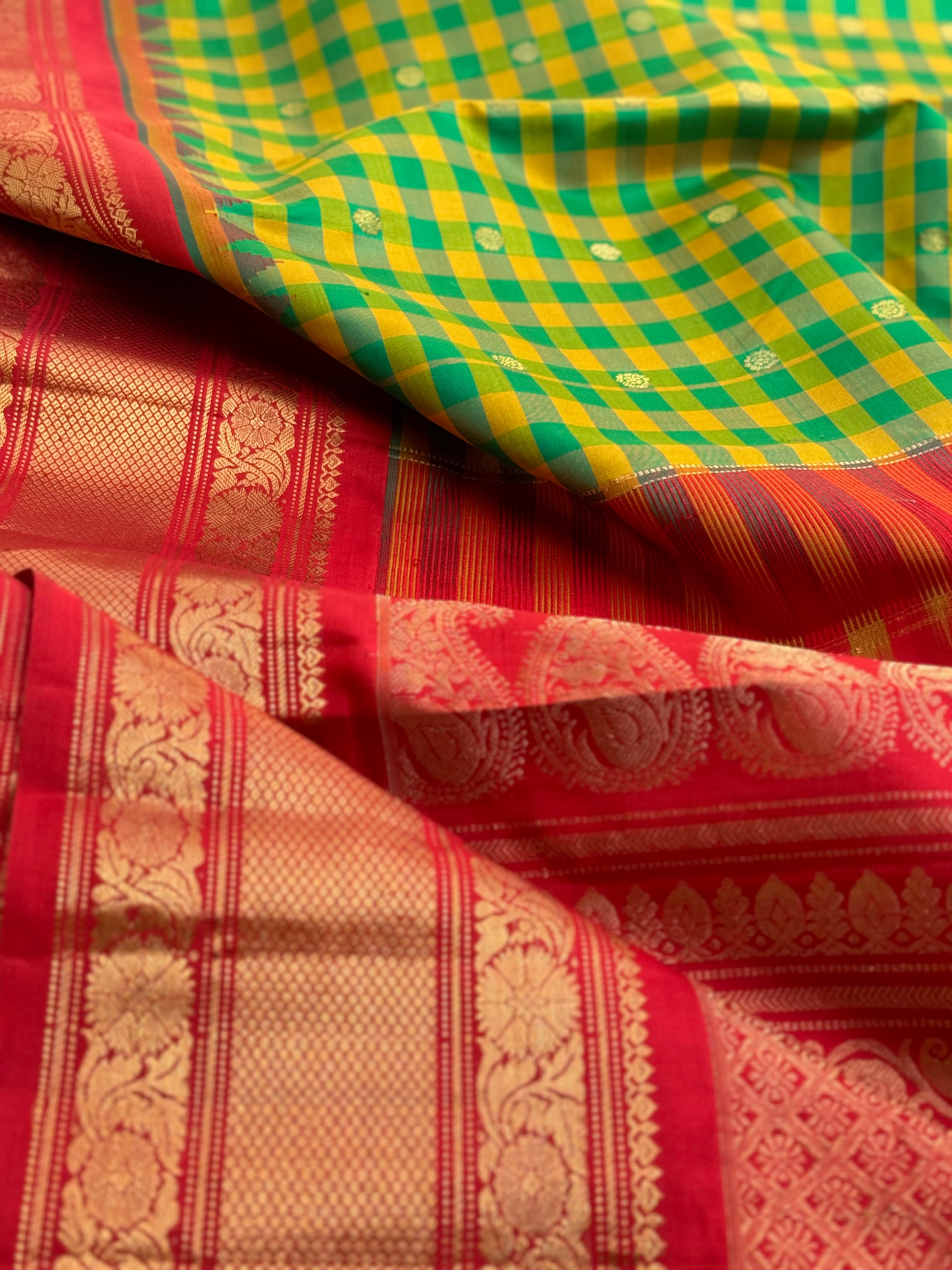 An Elegant yellow with green checks Gadwal silk saree