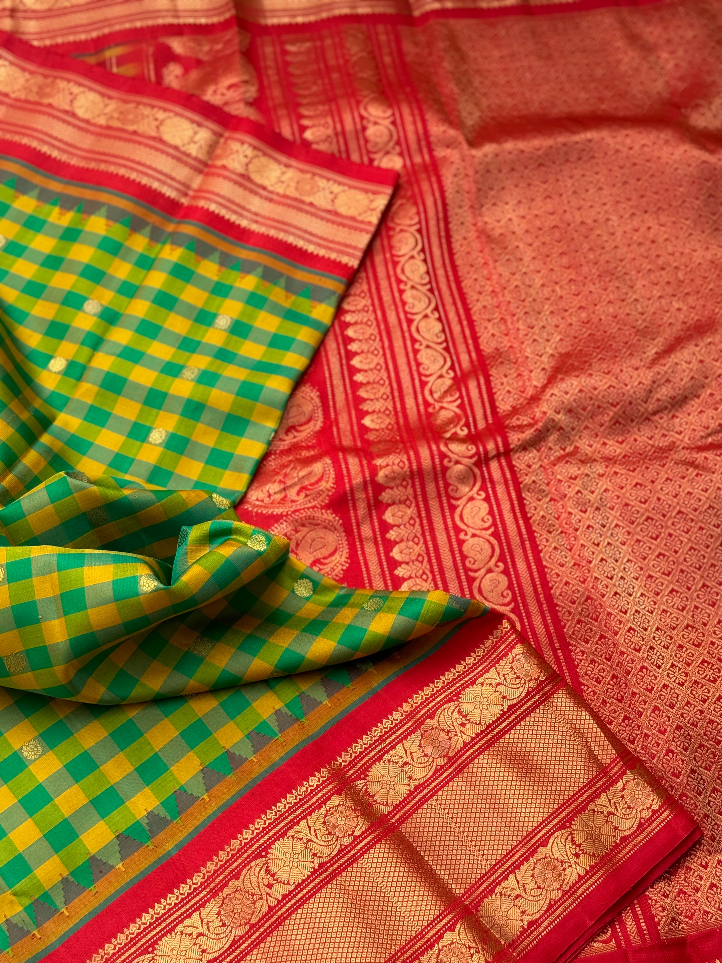 An Elegant yellow with green checks Gadwal silk saree