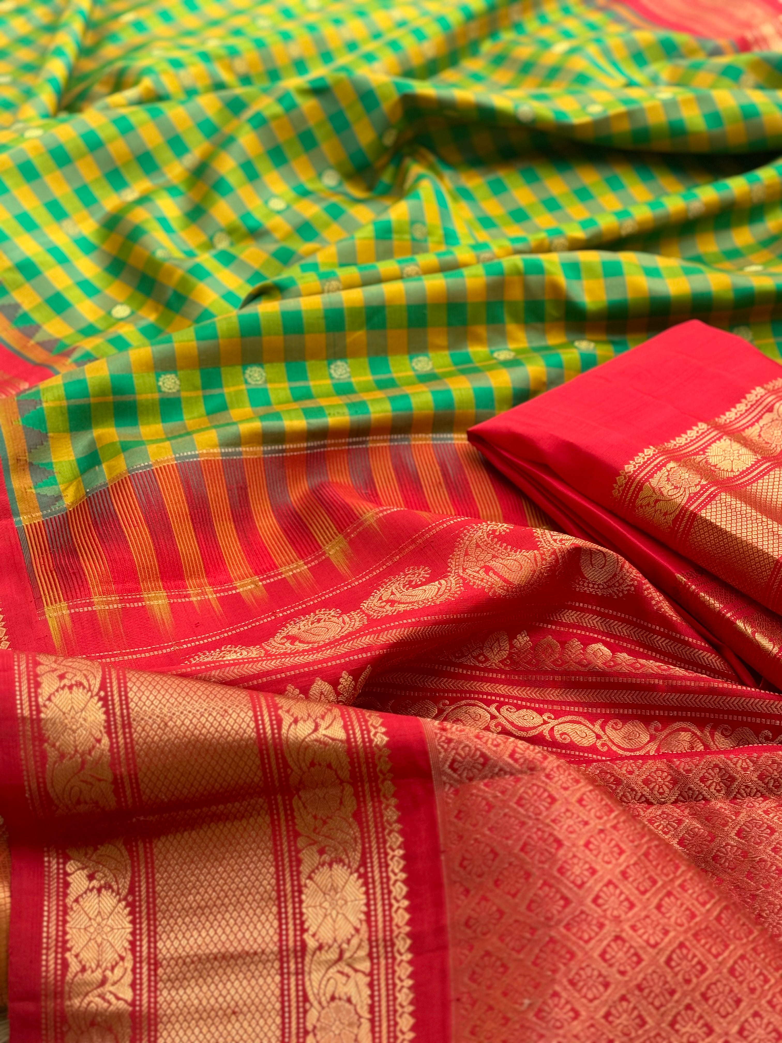 An Elegant yellow with green checks Gadwal silk saree