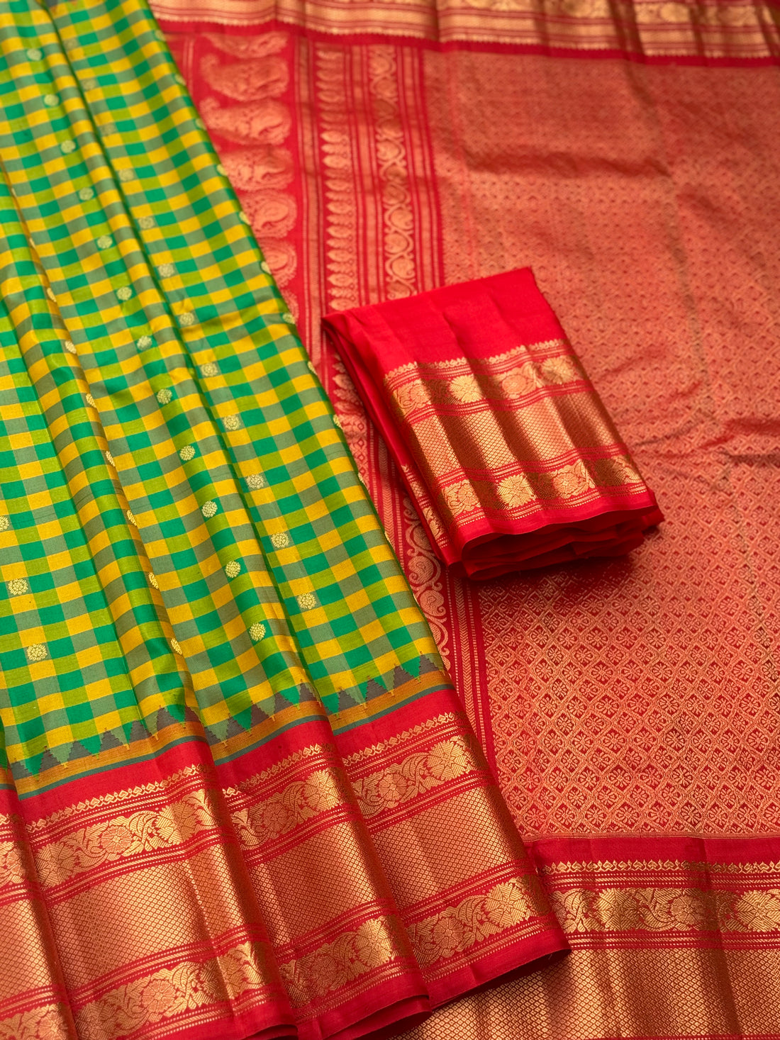 An Elegant yellow with green checks Gadwal silk saree