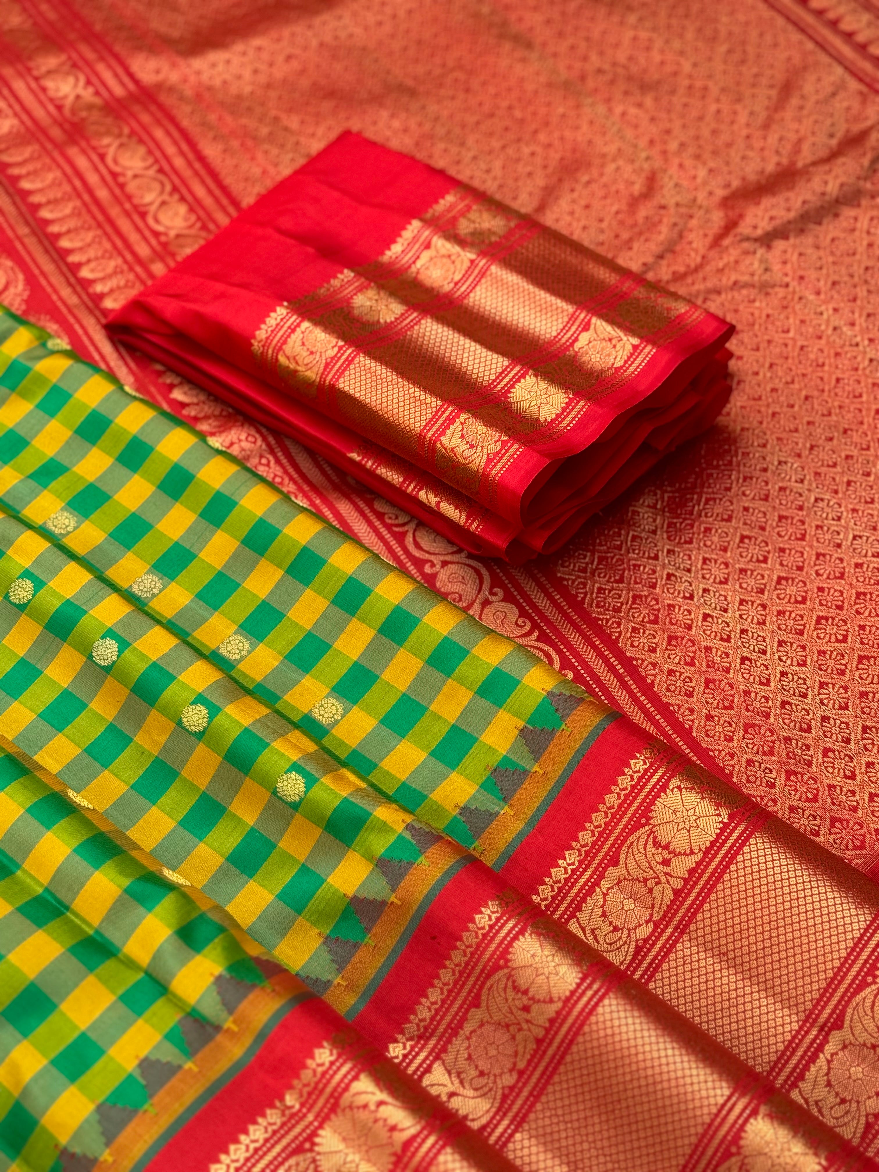 An Elegant yellow with green checks Gadwal silk saree