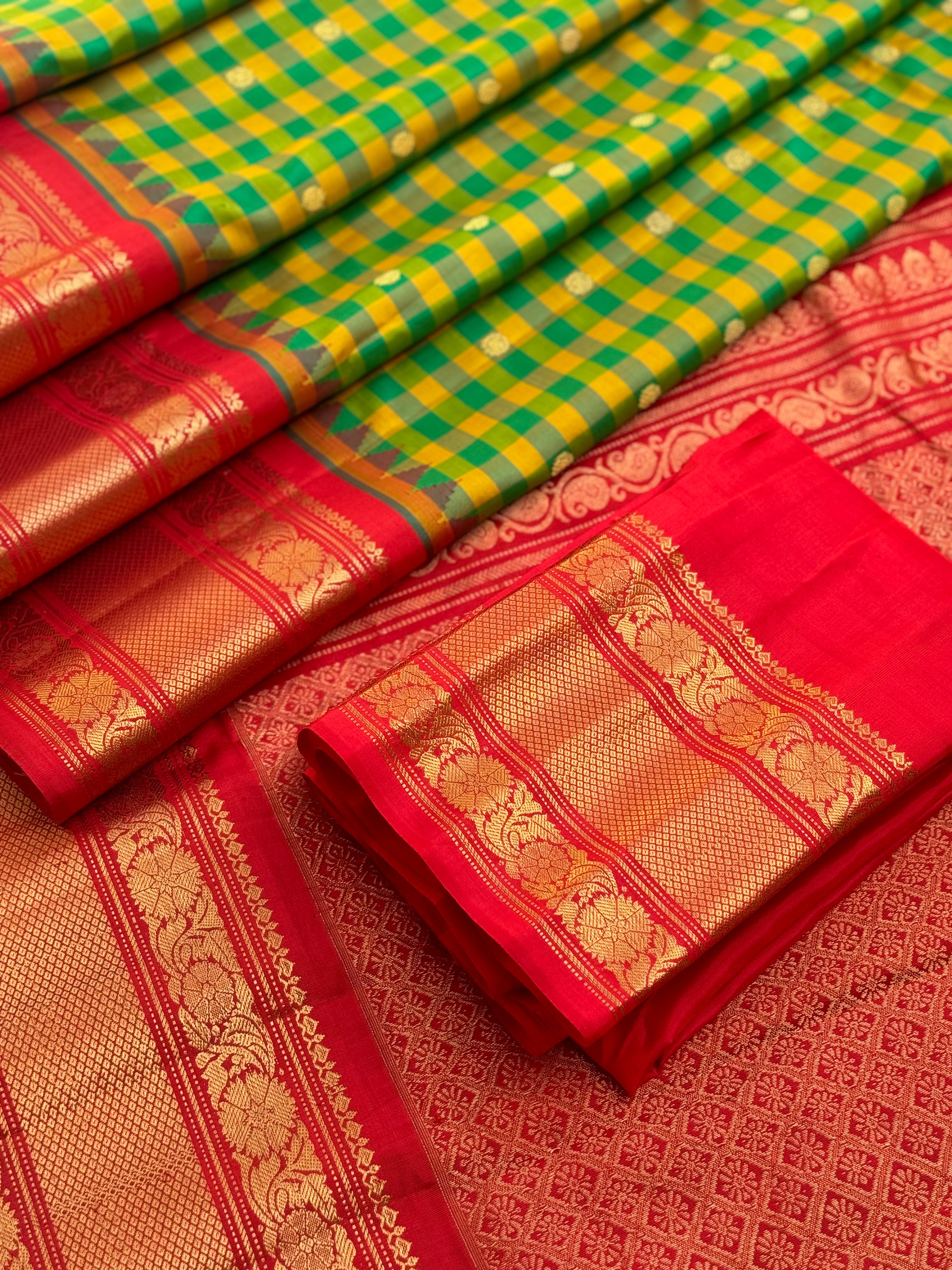 An Elegant yellow with green checks Gadwal silk saree