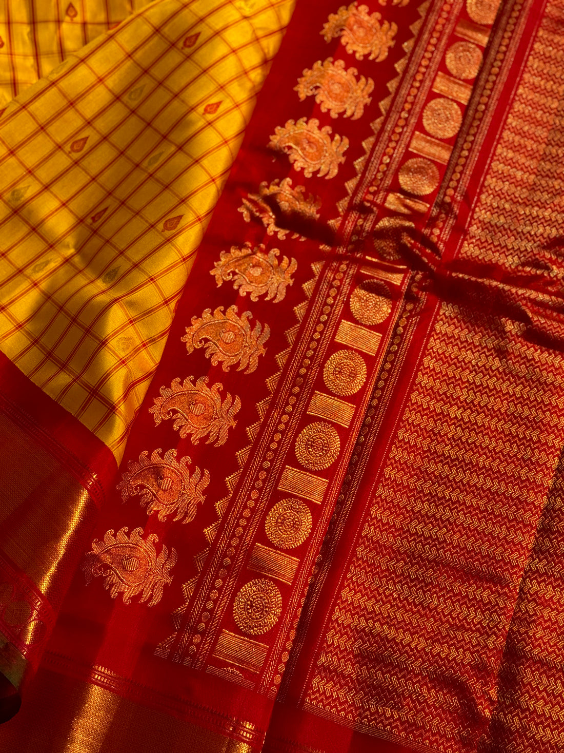 A gorgeous haldi with kumkum red handwoven gadwal silk saree